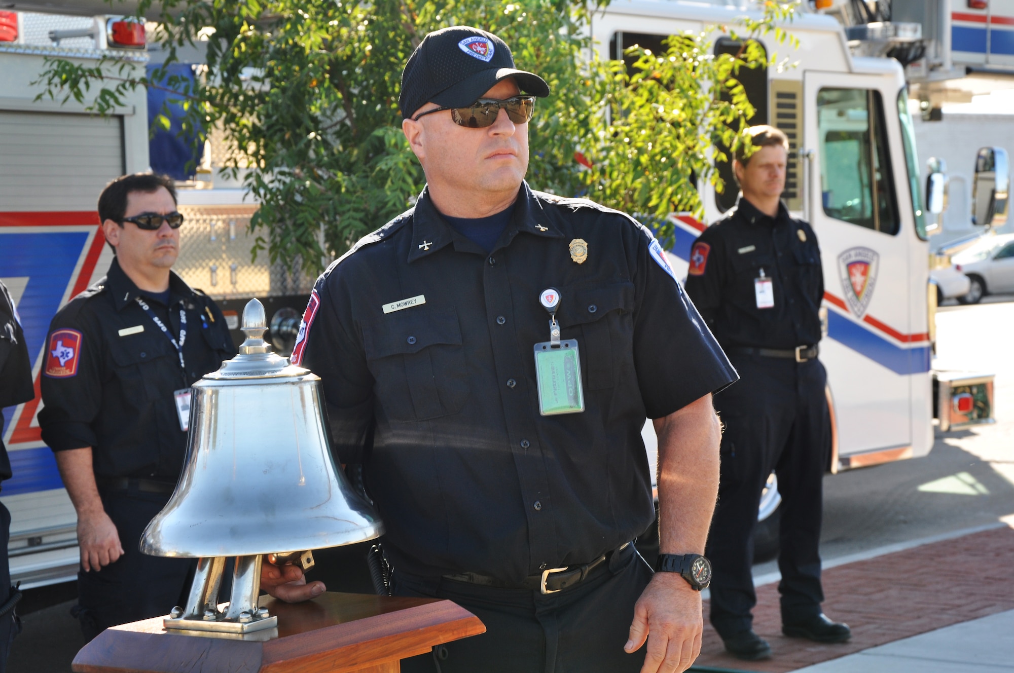 Capt. Chris Mowrey, San Angelo Fire Department, rings the bell three times for three sets during the September 11th Ceremony outside the San Angelo Fine Arts Museum in San Angelo Sept. 11.  The ringing of the bell is a long standing tradition for firefighters to honor those who have fallen in the line of duty. (Air Force Photo/ Staff Sgt. Tsuyoshi Shinzato)

