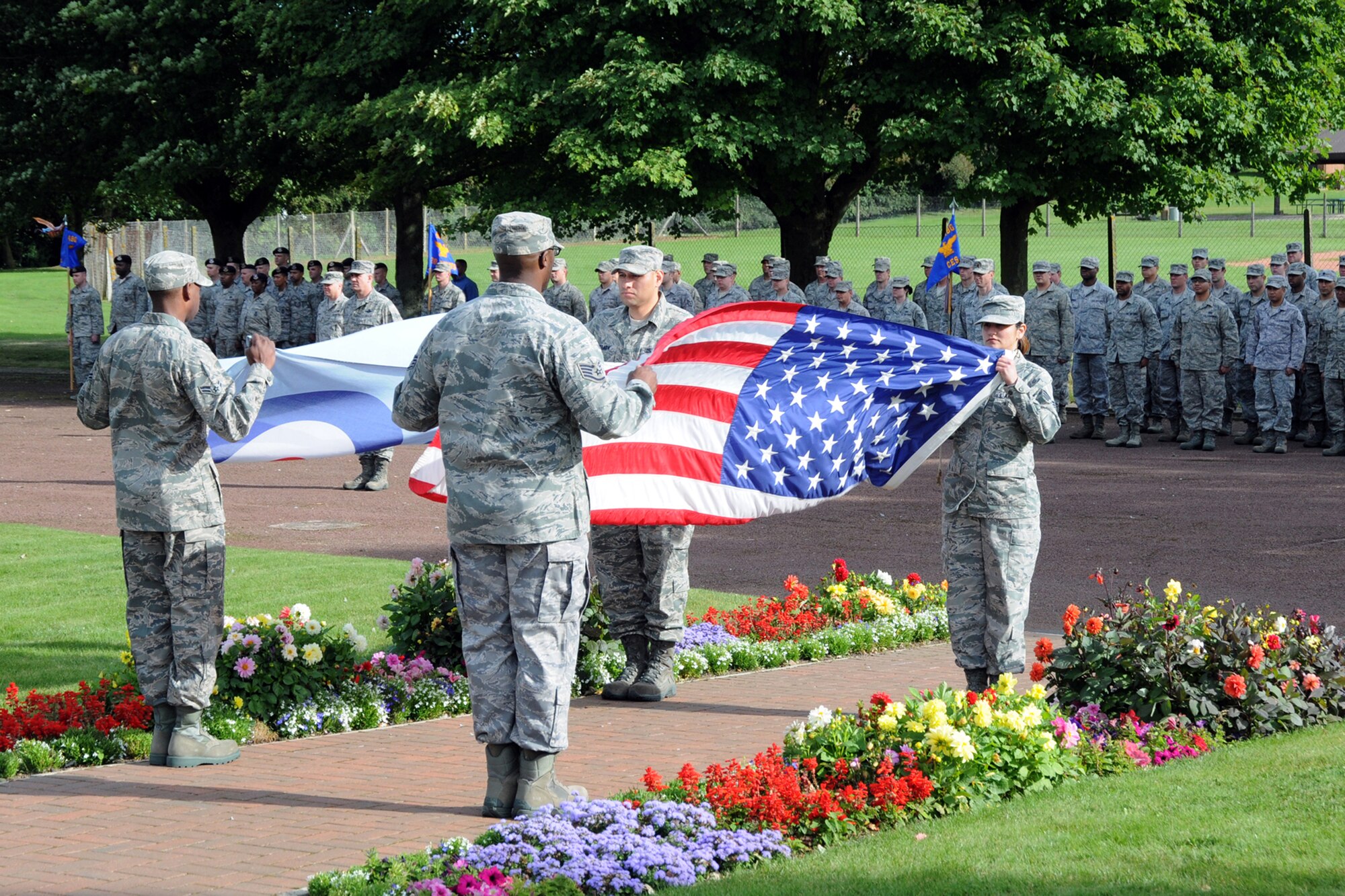 RAF CROUGHTON, United Kingdom – Members of the 422nd Air Base Group stand at attention during a retreat ceremony in honor of the victim of 9/11. The group also held a memorial prayer and ruck march honoring the eleventh anniversary of the attacks. (U.S. Air Force photo by Master Sgt. Randy Hillsgrove)