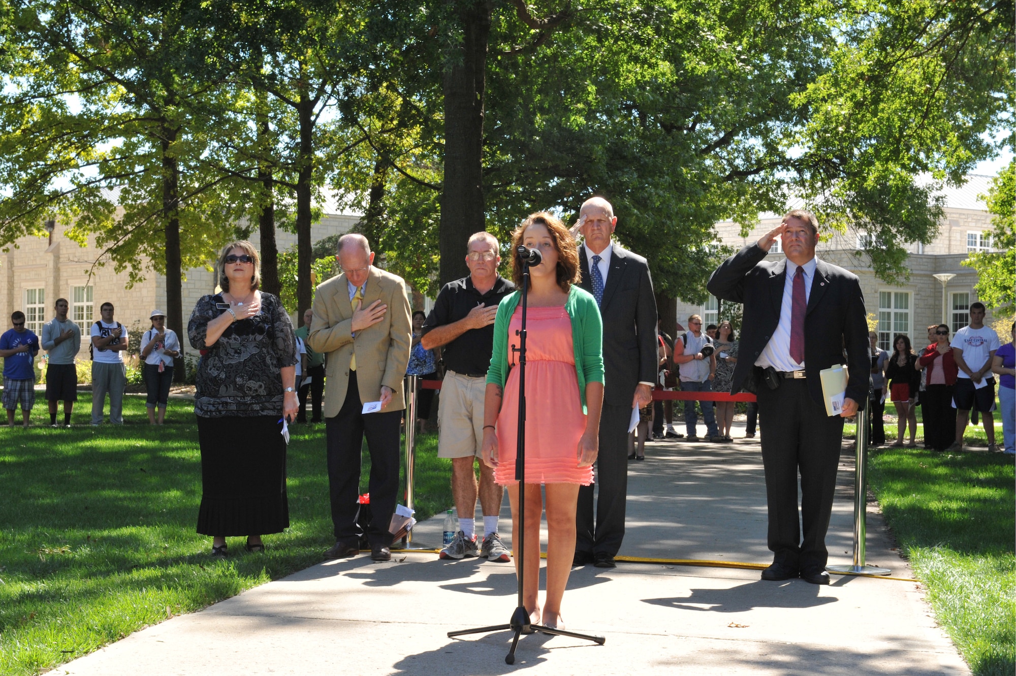 WARRENSBURG, Mo. -- Anna Kay, a University of Central Missouri freshman, sings the National Anthem during a 9/11 Remembrance Ceremony at UCM Sept. 11, 2012. The ceremony included a welcome from Charles Ambrose, UCM President, and keynote remarks from retired Brig. Gen. Larry D. Kay, executive director of the Missouri Veterans Commission. (U.S. Air Force photo/Heidi Hunt) (Released) 