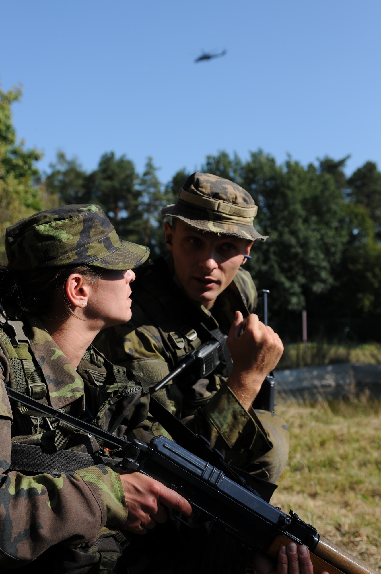 NAMEST AIR BASE, Czech Republic -- Czech Republic air force Lieutenant Jan Talacko, Exercise ground commander, uses information provided by forward air controllers to direct one of his troops as a Czech Republic helicopter flies above to provide close air support during a forward air control training scenario a part of Ramstein Rover 2012 Sept. 11, here. During this scenario German forward air controllers, who are based out of Baumholder, Germany, communicated with Czech Republic helicopter pilots to establish targets for the ground commander while mitigating risks to civilians and civilian assets. Sixteen NATO member nations are participating in RARO 12 to include: The United States, United Kingdom, Czech Republic, Belgium, Estonia, France, Germany, Greece, Italy, Latvia, the Netherlands, Norway, Poland, Slovakia, Slovenia and Turkey. The 81st Fighter Squadron is participating in the exercise as the United States counterpart to provide close air support for forward air controllers. This squadron often conducts close air support and forward air control missions with the FACs from Baumholder. Each nation's participation in RARO 12 ensures effective employment of airpower in support of alliance or coalition forces while mitigating risks to civilians in contingency operations. (U.S. Air Force photo by Senior Airman Natasha Stannard/Released)
