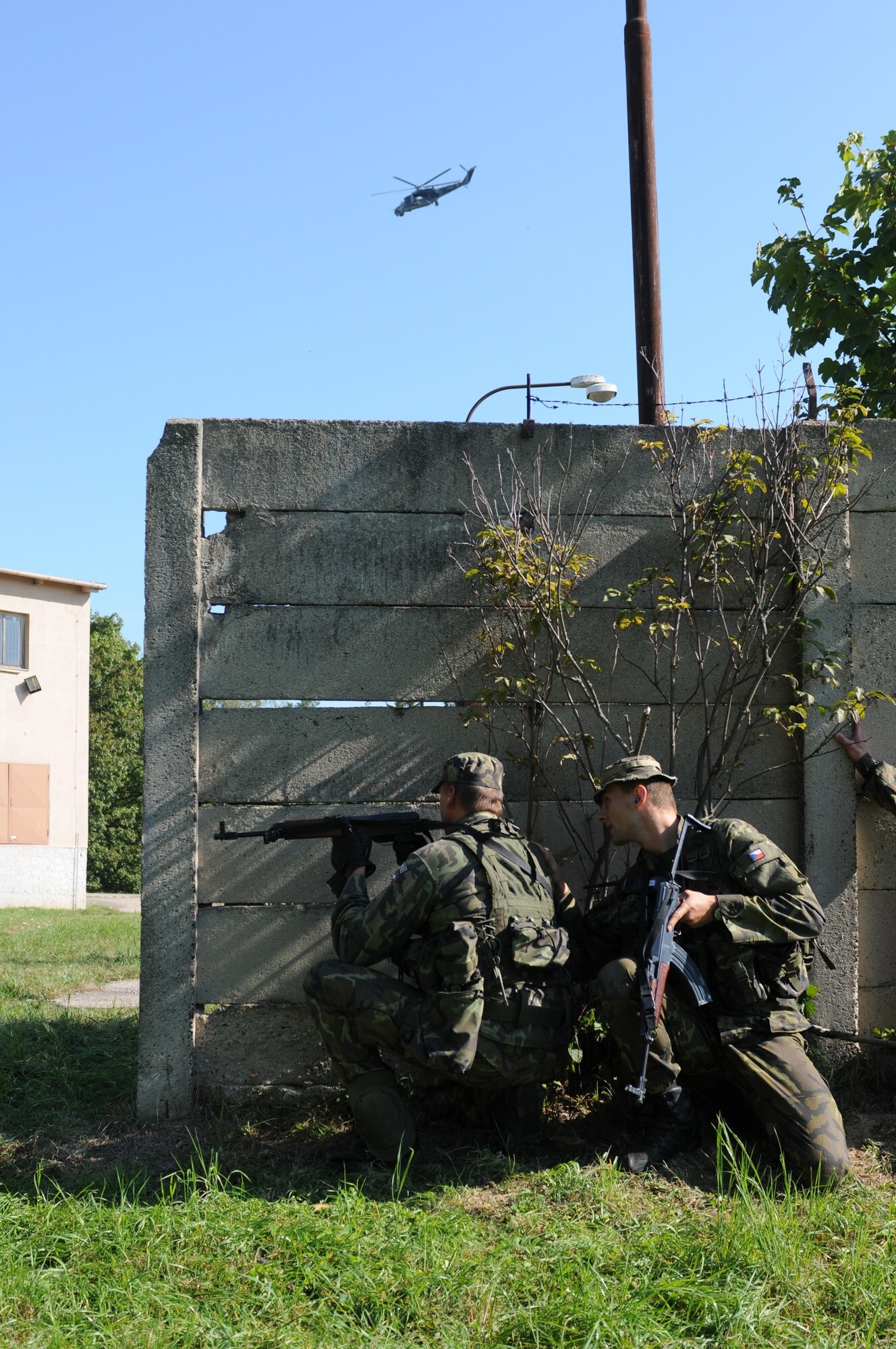 NAMEST AIR BASE, Czech Republic -- Czech Republic air force Lieutenant Jan Talacko, right, Exercise ground commander, directs one of his troops during a forward air control training scenario during Ramstein Rover 2012 Sept. 11, here. During this scenario German forward air controllers, who are based out of Baumholder, Germany, communicated with Czech Republic helicopter pilots to establish targets for the ground commander while mitigating risks to civilians and civilian assets. Sixteen NATO member nations are participating in RARO 12 to include: The United States, United Kingdom, Czech Republic, Belgium, Estonia, France, Germany, Greece, Italy, Latvia, the Netherlands, Norway, Poland, Slovakia, Slovenia and Turkey. The 81st Fighter Squadron is participating in the exercise as the United States counterpart to provide close air support for forward air controllers. This squadron often conducts close air support and forward air control missions with the FACs from Baumholder. Each nation's participation in RARO 12 ensures effective employment of airpower in support of alliance or coalition forces while mitigating risks to civilians in contingency operations. (U.S. Air Force photo by Senior Airman Natasha Stannard/Released) 