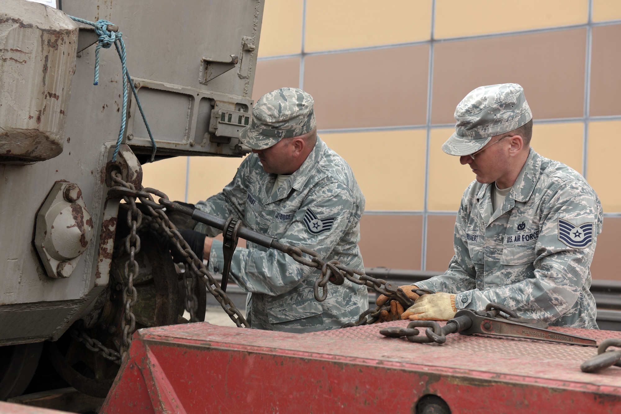 RAF ALCONBURY, United Kingdom – Staff Sgt. Adam Wright and Tech. Sgt. Jason Kerkaert, both from the 423rd Civil Engineer Squadron heavy equipment shop, secure a Tiger I tank on a flatbed truck. The Tiger I, one of only six Tiger I tanks left in the world, was transported to the National Armor and Cavalry Museum at Fort Benning, Ga., Sept. 10. The tank was stored at RAF Alconbury during litigation to have it on display at the museum. Tiger I is a German heavy tank developed in 1942 and used in World War II. (U.S. Air Force photo by Master Sgt. John Barton)