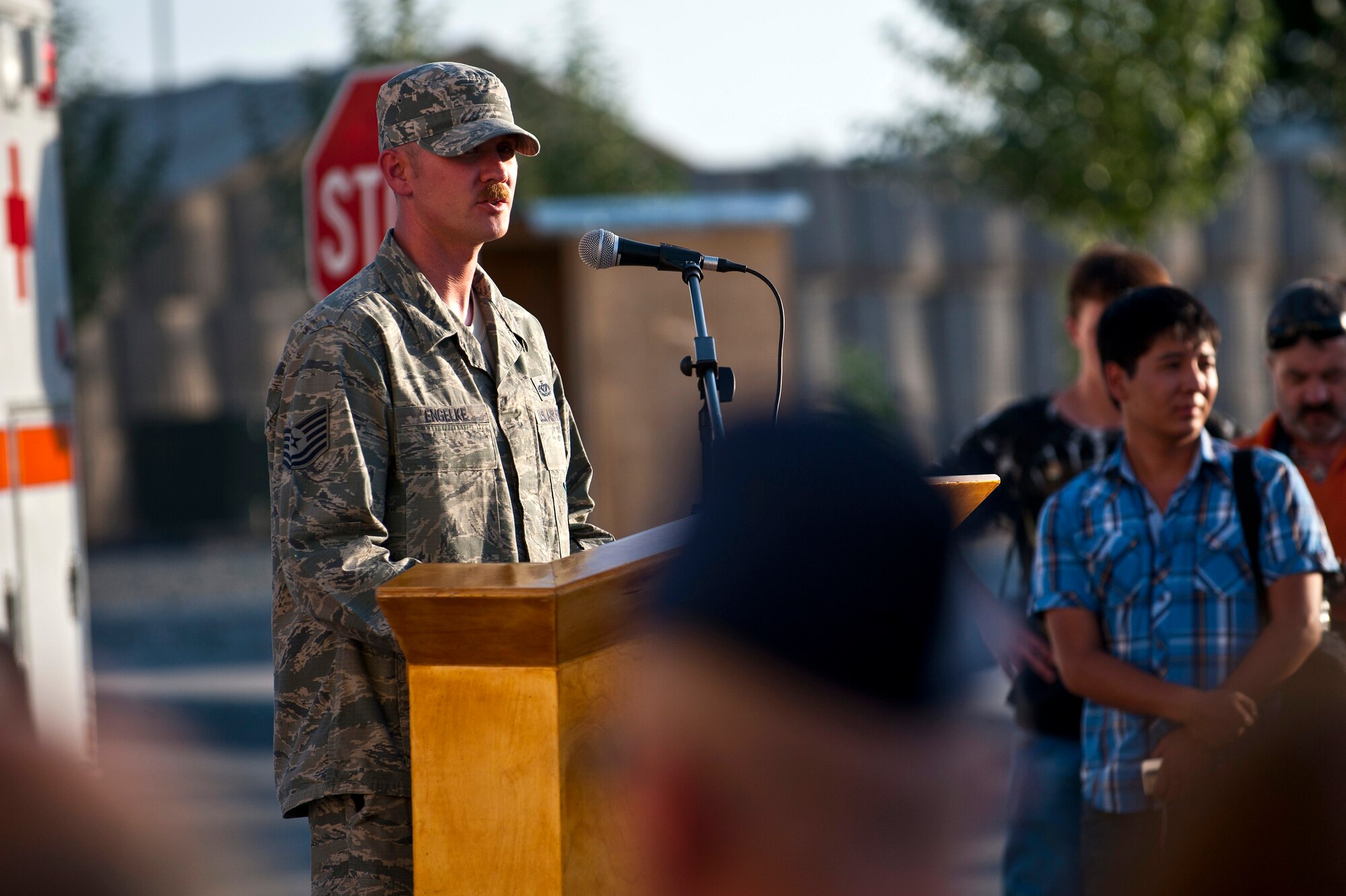 Tech. Sgt. Christopher Engelke speaks about heroic actions of first responders during a 9/11 remembrance ceremony at the Transit Center at Manas, Kyrgyzstan, Sept. 11, 2012. The 343 first responders lost their lives during the 9/11 terrorist attacks. Engelke is a 376th Expeditionary Civil Engineer Squadron firefighter deployed out of Fairchild Air Force Base, Wash. and a native of Mason City, Wash. (U.S. Air Force photo/Senior Airman Brett Clashman)