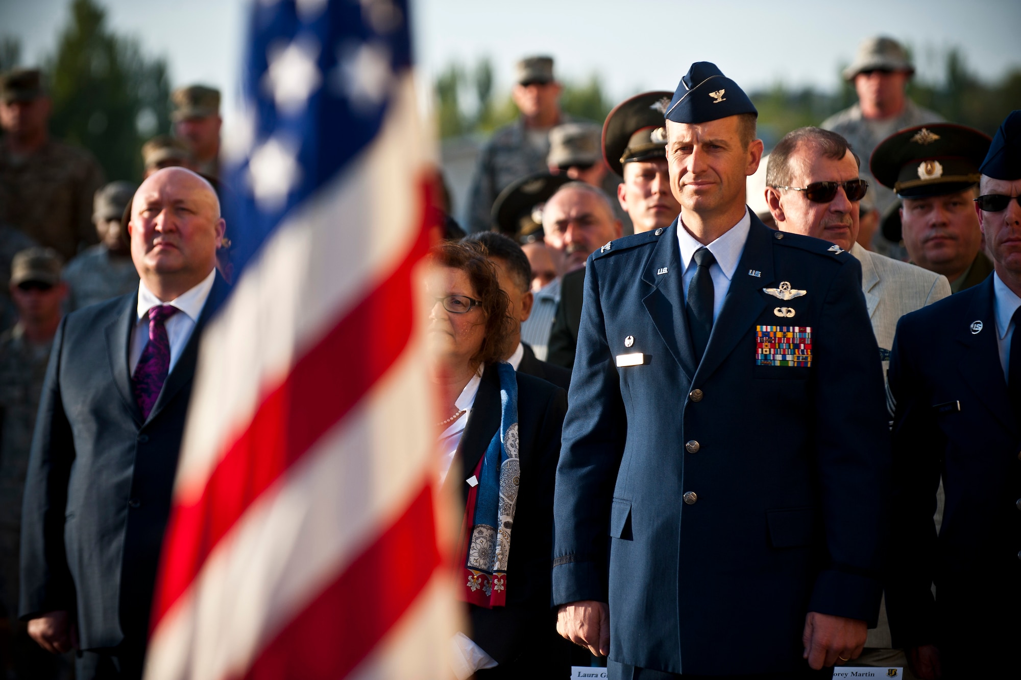 Col. Corey Martin stands at attention during a 9/11 remembrance ceremony at the Transit Center at Manas, Kyrgyzstan, Sept. 11, 2012. The ceremony commemorated the 11th anniversary of the 9/11 terrorist attacks at the World Trade Center, Pentagon, and United Flight 93. Martin is the 376th Air Expeditionary Wing commander. (U.S. Air Force photo/Senior Airman Brett Clashman)