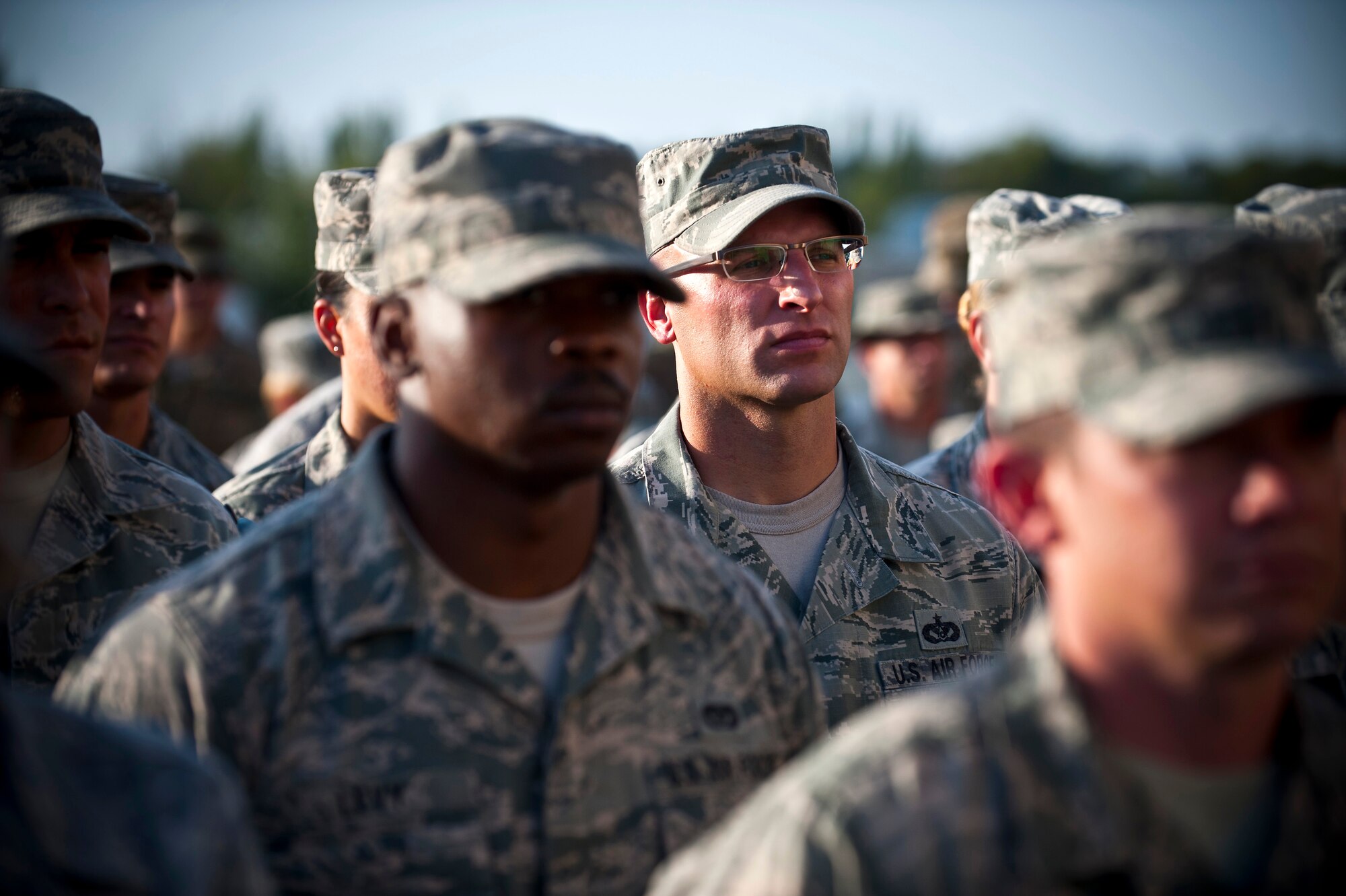 Tech. Sgt. Jason Landry stands in formation during a 9/11 remembrance ceremony at the Transit Center at Manas, Kyrgyzstan, Sept. 11, 2012. Service members, honored guests and Kyrgyz Republic partners attended the ceremony to honor the victims of the 9/11 terrorist attacks. Landry is a 376th Expeditionary Civil Engineer Squadron firefighter deployed out of Barksdale Air Force Base, La. (U.S. Air Force photo/Senior Airman Brett Clashman) 