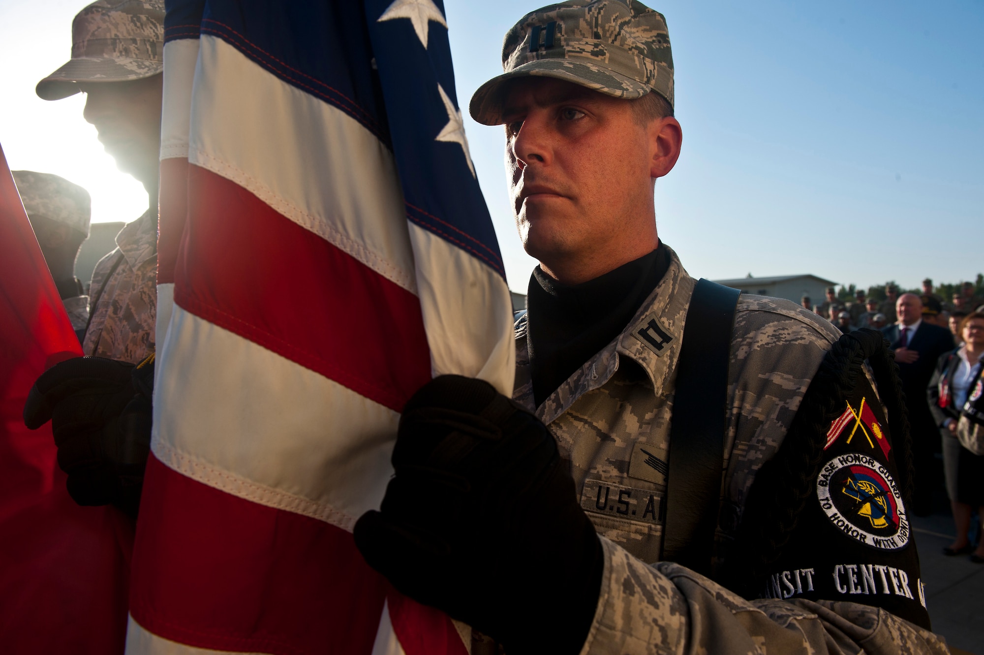 Capt. Ryan Kerr posts the Colors with fellow service members during a 9/11 remembrance ceremony at the Transit Center at Manas, Kyrgyzstan, Sept. 11, 2012. The ceremony honored the lives of the first responders who made the ultimate sacrifice during the 9/11 terrorist attacks 11 years ago. Kerr is the Transit Center Theater Security Cooperation chief of military cooperation deployed out of Schriever Air Force Base, Colo. and a native of Newcastle, Texas. (U.S. Air Force photo/Senior Airman Brett Clashman)    