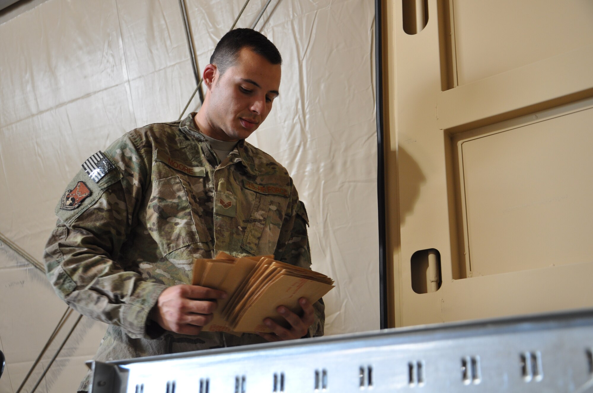 Senior Airmen Stephen Moore, aircraft parts store technician, 451st Expeditionary Logistics Readiness Squadron, perfroms a quick inventory on parts located in a storage shelf.  The APS is responsible for stocking parts and items for the wide variety of aircraft assigned to the 451st Air Expeditionary Wing located at Kandahar Airfield, Afghanistan. (U.S. Air Force Photo by Capt. Frank Hartnett) 
