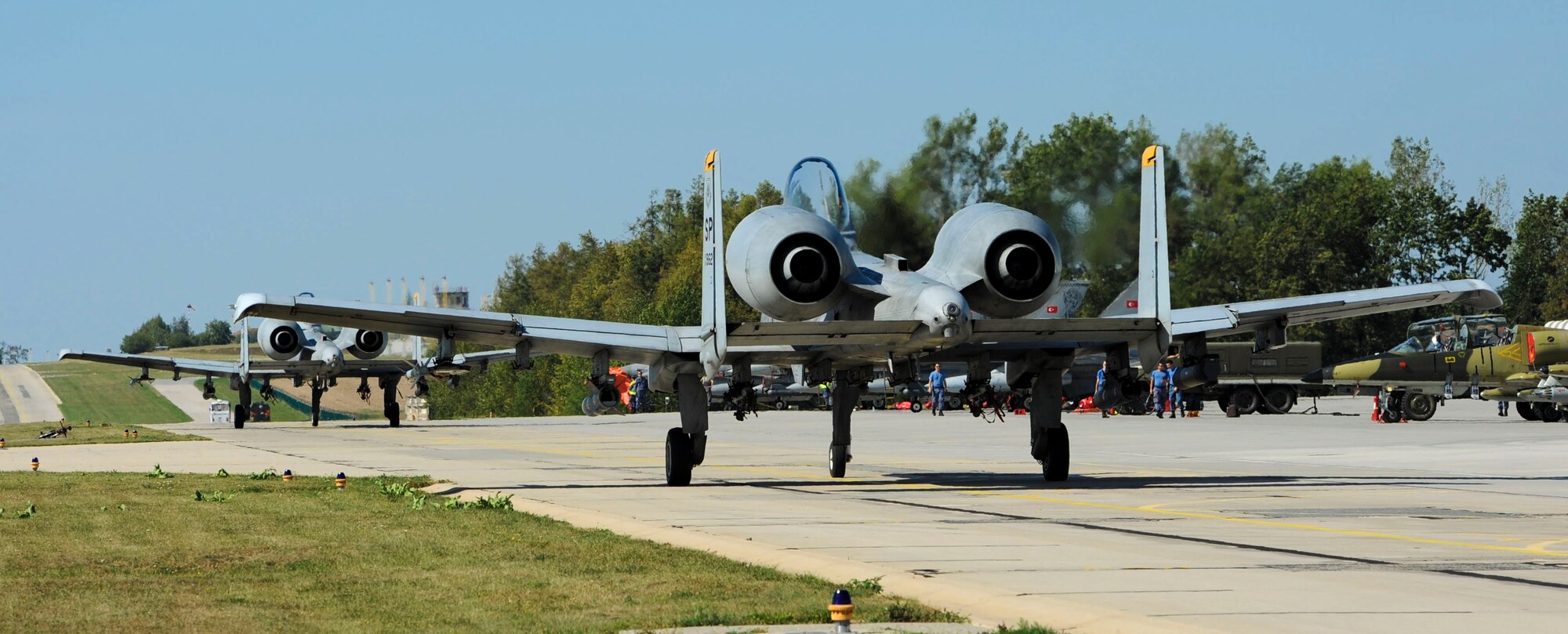 NAMEST AIR BASE, Czech Republic -- A-10 Thunderbolt IIs taxi down the runway before taking off for a close air support and forward air control training mission Sept. 10, during Ramstein Rover 2012 here. RARO12 is a NATO-partnership building exercise involving more than 16 nations. A-10 Thunderbolt IIs from the 81st FS are participating in the exercise to provide close air support to partnering nations and practice forward air control missions with their NATO allies in international security assistance force realistic scenarios. Participating in exercises like RARO12 ensures effective employment of airpower in support of alliance or coalition forces while mitigating risks to civilians in contingency operations.(U.S. Air Force photo by Senior Airman Natasha Stannard/Released)