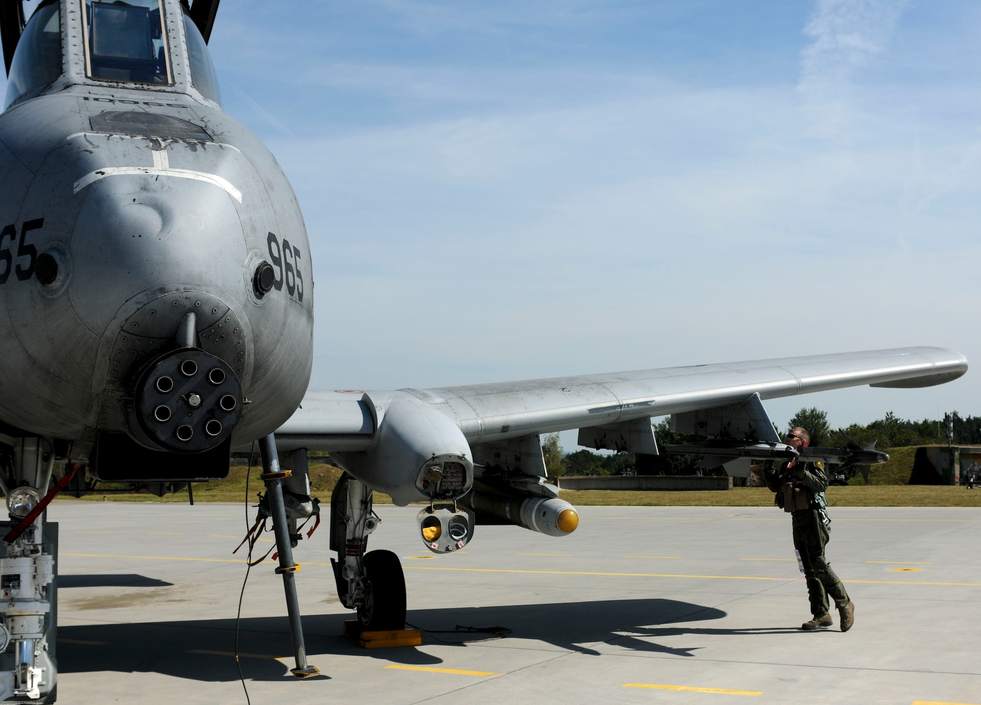 NAMEST AIR BASE, Czech Republic -- Maj. Andy Korsmo, 81st Fighter Squadron A-10 Thunderbolt II pilot, inspects the A-10 he is flying for a close air support mission before takeoff Sept. 10, during Ramstein Rover 2012 here. During this mission the A-10s provided support to German and Italian forward air controllers. RARO12 is a NATO partnership building exercise involving more than 16 nations. A-10 Thunderbolt IIs from the 81st FS are participating in the exercise to provide close air support to partnering nations and practice forward air control missions with their NATO allies in international security assistance force realistic scenarios. Participating in exercises like RARO12 ensures effective employment of airpower in support of alliance or coalition forces while mitigating risks to civilians in contingency operations. (U.S. Air Force photo by Senior Airman Natasha Stannard/Released)
