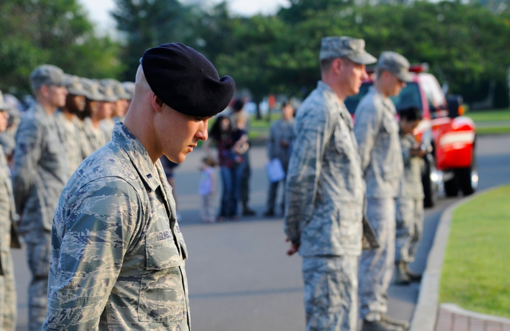 U.S. Air Force 1st Lt. Harlan Glinski, 35th Security Forces Squadron operations officer, bows his head in prayer during the Patriot Day Retreat Ceremony at Misawa Air Base, Japan, Sept. 11, 2012. The ceremony served as a time to honor the victims and first responders in the 9/11 terrorist attacks. (U.S. Air Force photo by Staff Sgt. April Quintanilla/Released)