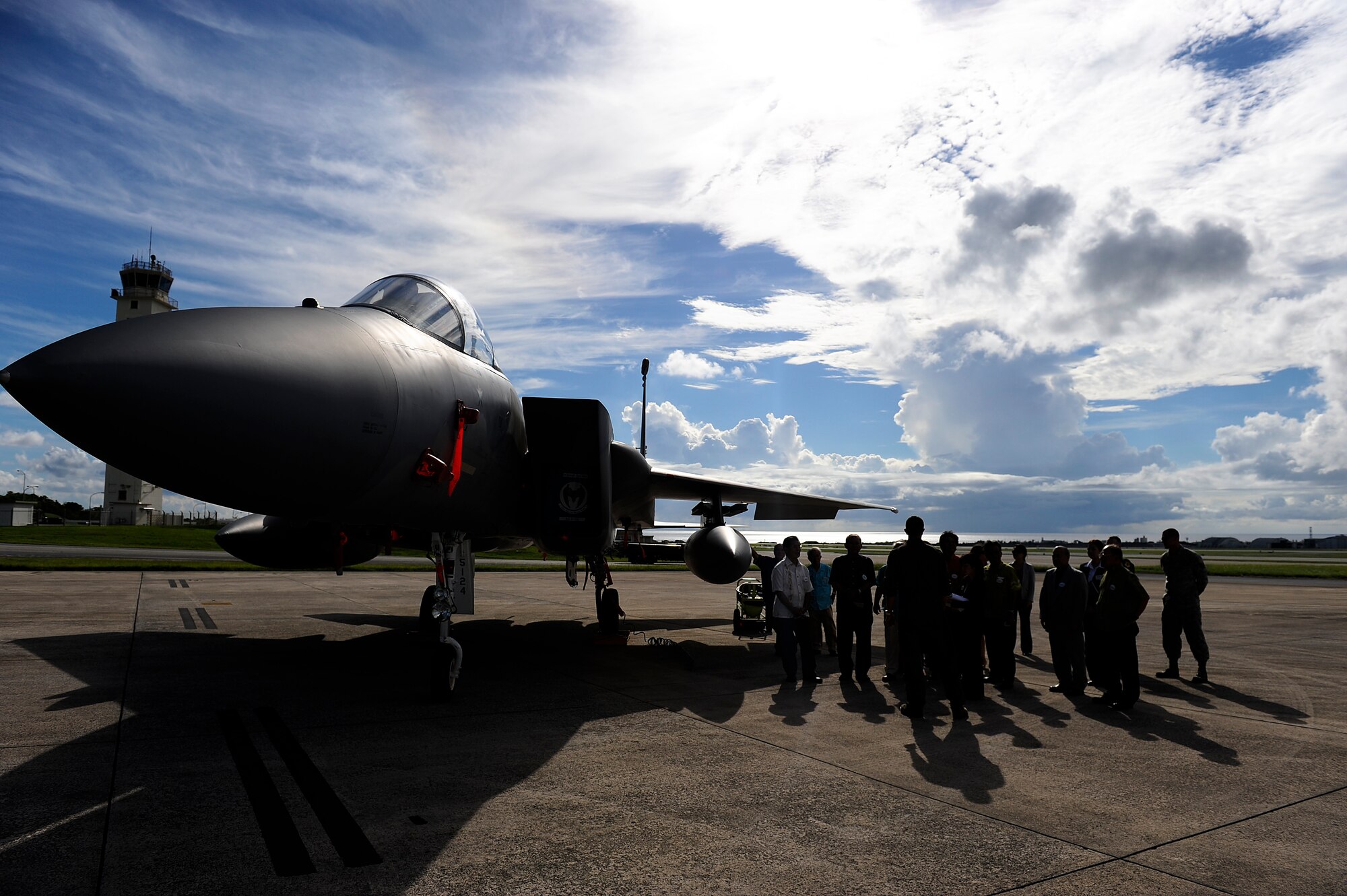 Honorary commanders visiting Kadena Air Base, Japan, as part of the Honorary Commander orientation tour, talk with a 44th Fighter Squadron F-15C Eagle pilot on the Kadena flightline Sept. 7, 2012. During the tour, more than 30 local Okinawan leaders caught a glimpse of the wing's mission through demonstrations by the 18th Civil Engineer Group and the 18th Security Forces Squadron's military working dogs. The visitors were also treated to a showcase of a Kadena F-15C Eagle and Joint Base Langley-Eustis F-22 Raptor on Kadena's flightline. (U.S. Air Force photo/ Senior Airman Maeson L. Elleman)