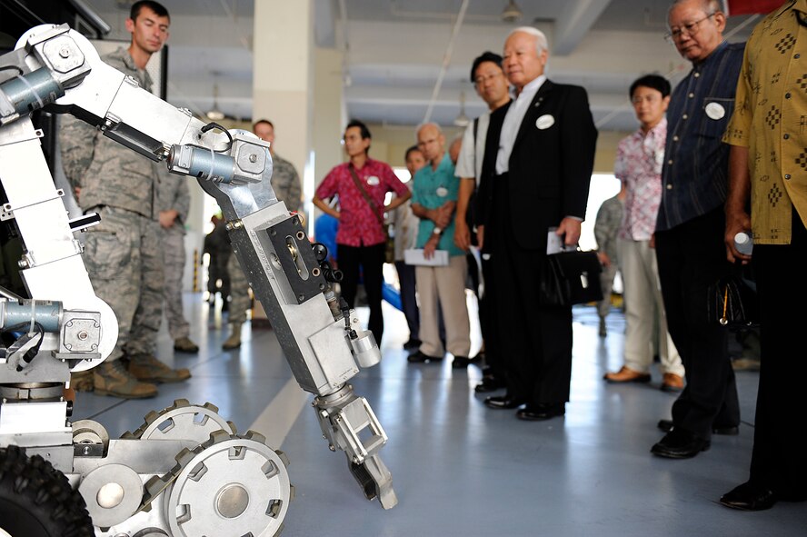 An 18th Civil Engineer Group, Explosive Ordnance Disposal technician gives a robot demonstration during the Honorary Commander orientation tour at the Kadena Air Base, Japan, fire station Sept. 7, 2012. The event was held as part of the Honorary Commander program, which is designed to build a better relationship and reinforce ties between the U.S. military and the community as well as give commanders the opportunity to showcase the 18th Wing mission. (U.S. Air Force photo/ Senior Airman Maeson L. Elleman)