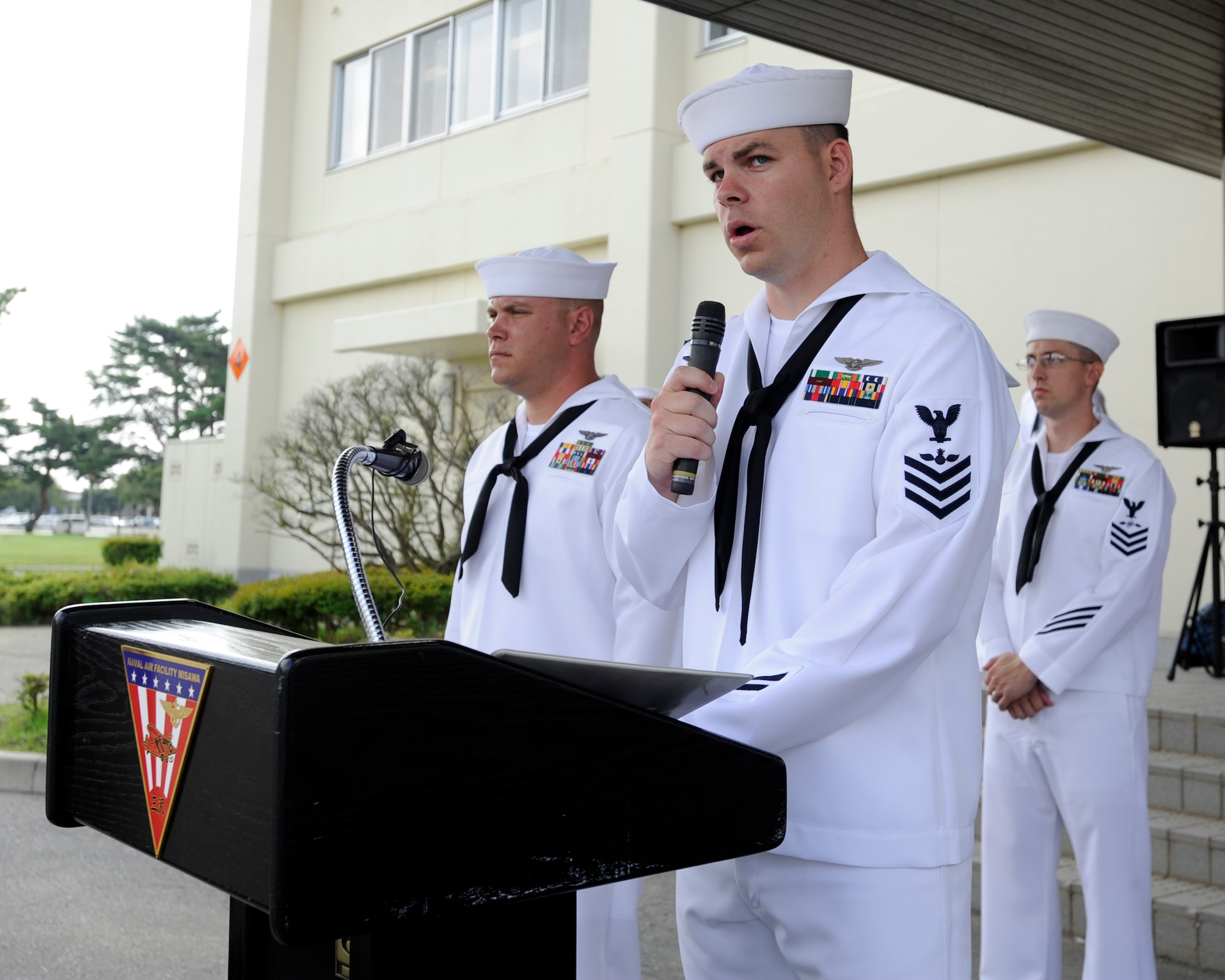 Chief (select)Aviation Ordnanceman William Kenney, from Owosso, Mich., reads a poem entitled "United We Stand" during  a 9/11 Remembrance Ceremony onboard Naval Air Facility Misawa, Japan, Sept. 11, 2012.  Navy Misawa chief petty officer selectees conducted the ceremony to commemorate the 11th anniversary of the Sept. 11, 2001 terrorist attacks. (U.S. Navy photo by Senior Chief Mass Communication Specialist Daniel Sanford/RELEASED)