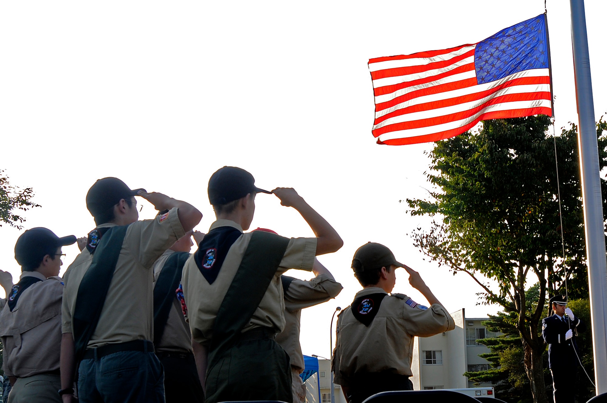 Members of the Boy Scouts of American render a salute to the American flag on Sept. 11, 2012 at Misawa Air Base, Japan. The 35th Fighter Wing held a retreat ceremony to honor and remember those who were affected by the tragic events that occurred 11 years ago. (U.S. Air Force photo by 2nd Lt. Son Lee/Released)