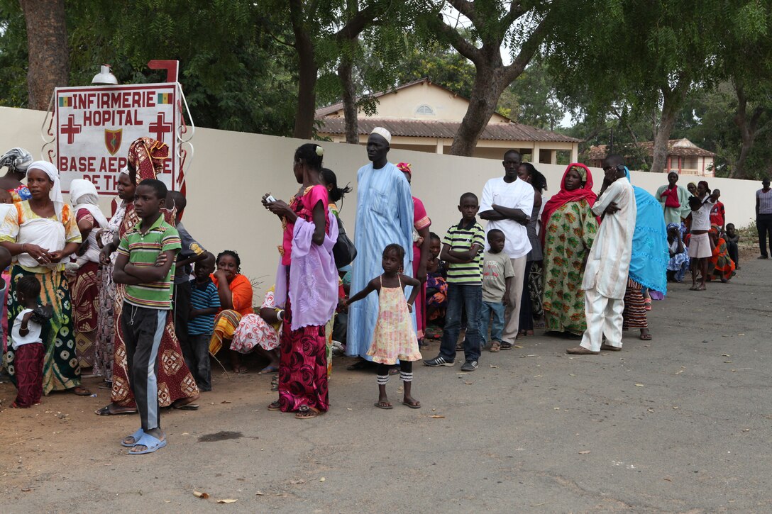 Local villagers of Thies, Senegal, wait in line to be let in the gates of the clinic here, July 11. The medical care provided by the U.S. is part of Exercise Western Accord 2012. U.S. service members, primarily Reservists from the Marines, Army, Navy, and Air Force are taking part in Western Accord -- a multi-lateral exercise with Senegalese and several Western African nations. The training exercise runs from June 26 - July 24 and involves Armed Forces of Senegal, Burkina Faso, Guinea, Gambia and France.
