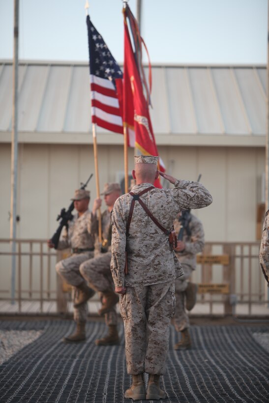 Sgt. Maj. William T. Sowers, Combat Logistics Regiment-15 sergeant major, salutes as the unit colors retire from a transfer of authority ceremony, Sept. 10. CLR-15 is organized to support the same range of logistics functions as 1st Marine Logistics Group (Forward) and is perfectly designed to sustain the new security force assistance Marine Air-Ground Task Force.