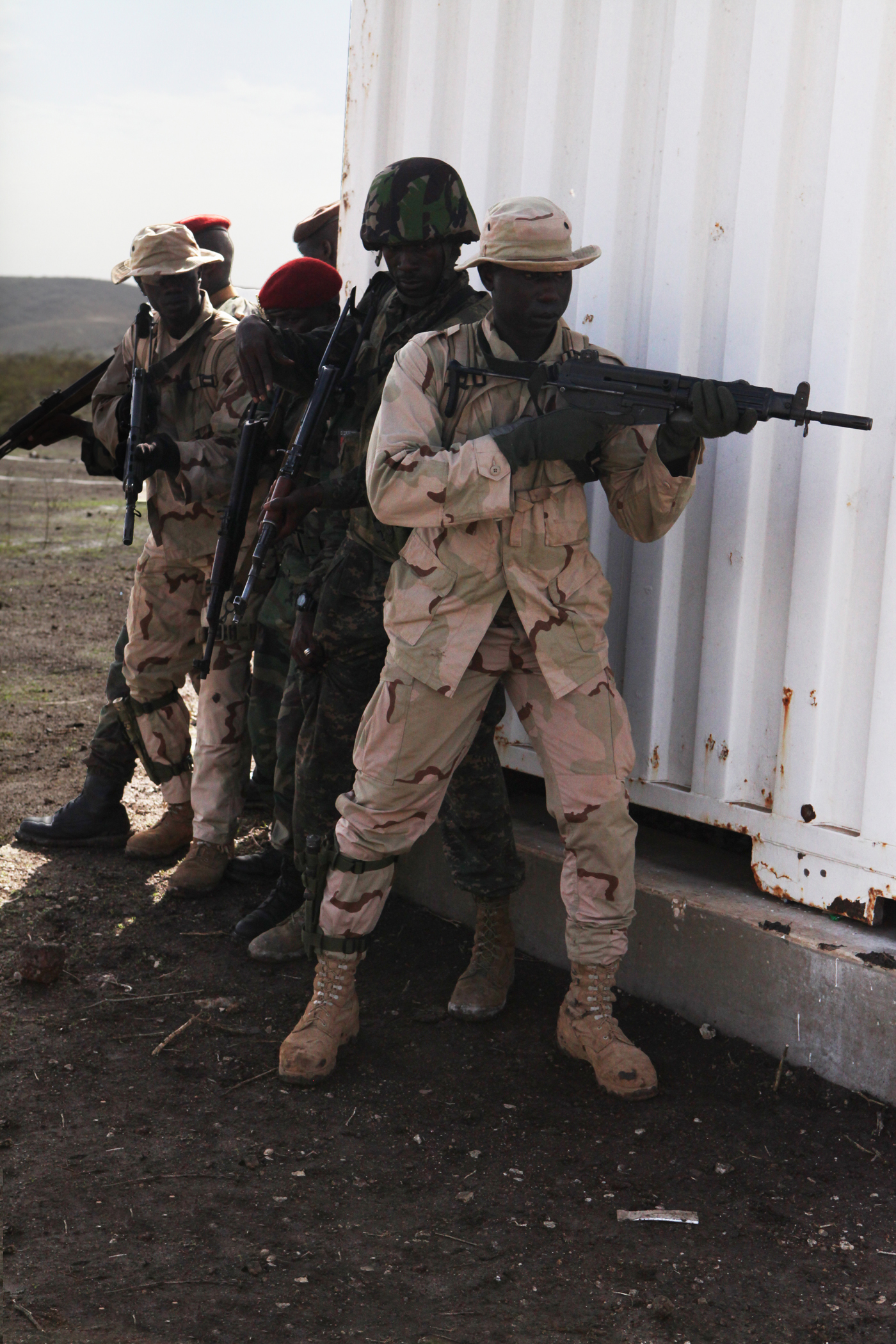 A group of African nations participating in Exercise Western Accord 2012, practices stacking up to enter a building at urban combat techniques training, July 13. U.S. service members, primarily Reservists from the Marines, Army, Navy, and Air Force are taking part in WA-12 -- a multi-lateral exercise with Senegalese and several Western African nations. The training exercise runs from June 26 - July 24 and involves Armed Forces of Senegal, Burkina Faso, Guinea, Gambia and France.