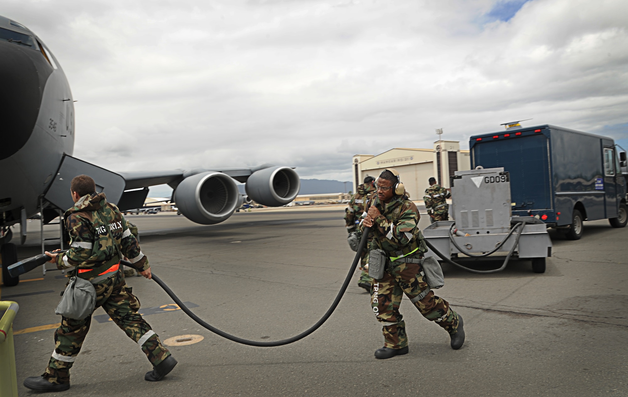 Airmen from the 154th Maintenance Squadron and the 203rd Air Refueling Squadron participate in the Operational Readiness Exercise on Joint Base Pearl Harbor-Hickam, Hawaii, Sept. 13. During the exercise, Airmen had to don protective gear to protect against a simulated chemical attack, while still performing their normal maintenance duties on the KC-135 Stratotanker. (U.S. Air Force photo/Senior Airman Lauren Main)