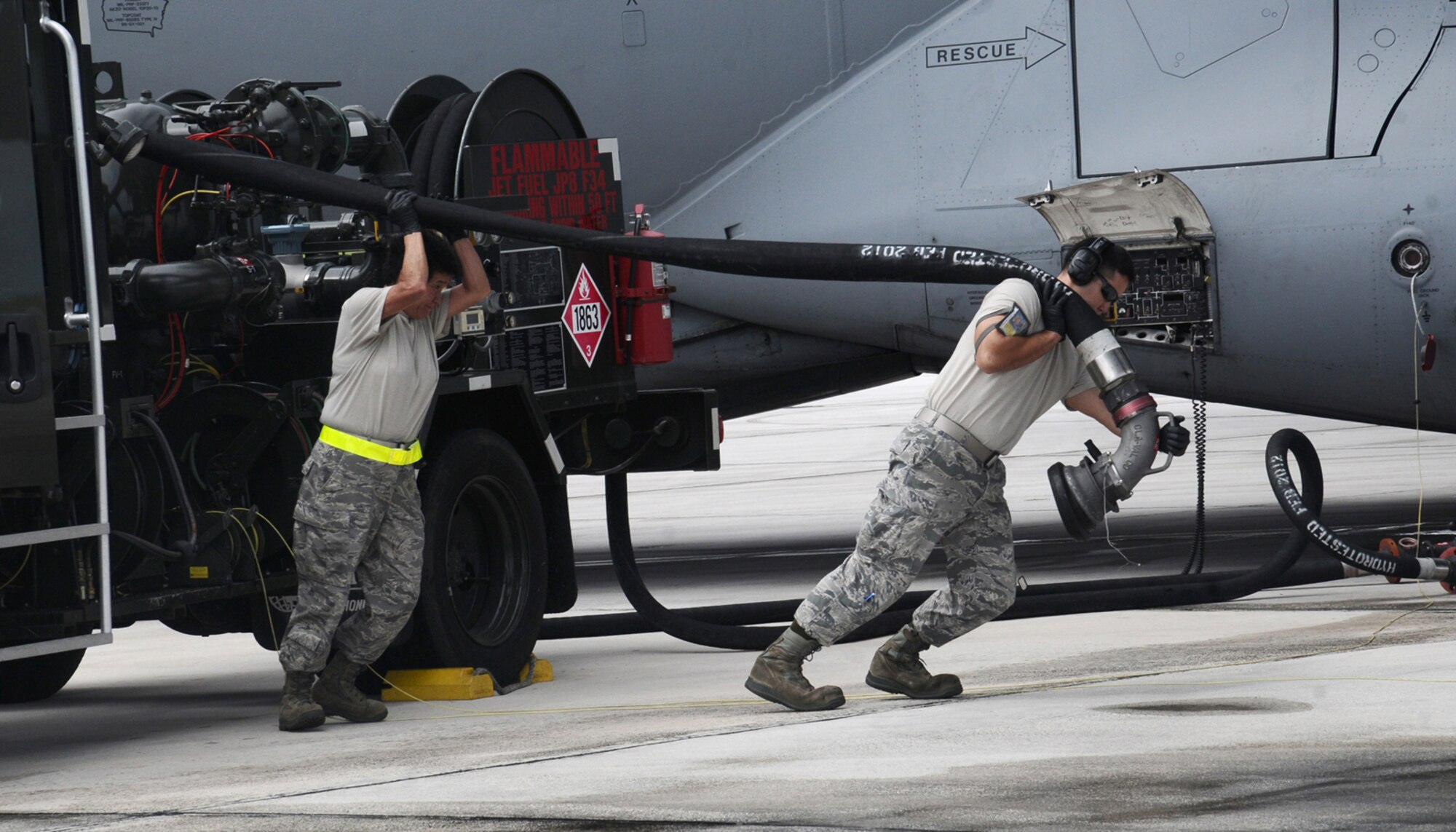 ANDERSEN AIR FORCE BASE, Guam-- Servicemembers work together to fuel a aircraft on the flightline here, Sept. 7. During normal day-to-day operations, 36th Logistic Readiness Squadron fuel distribution element conducts 30 to 45 fuel runs per day. (U.S. Air Force photo by Airman 1st Class Mariah Haddenham/Released)