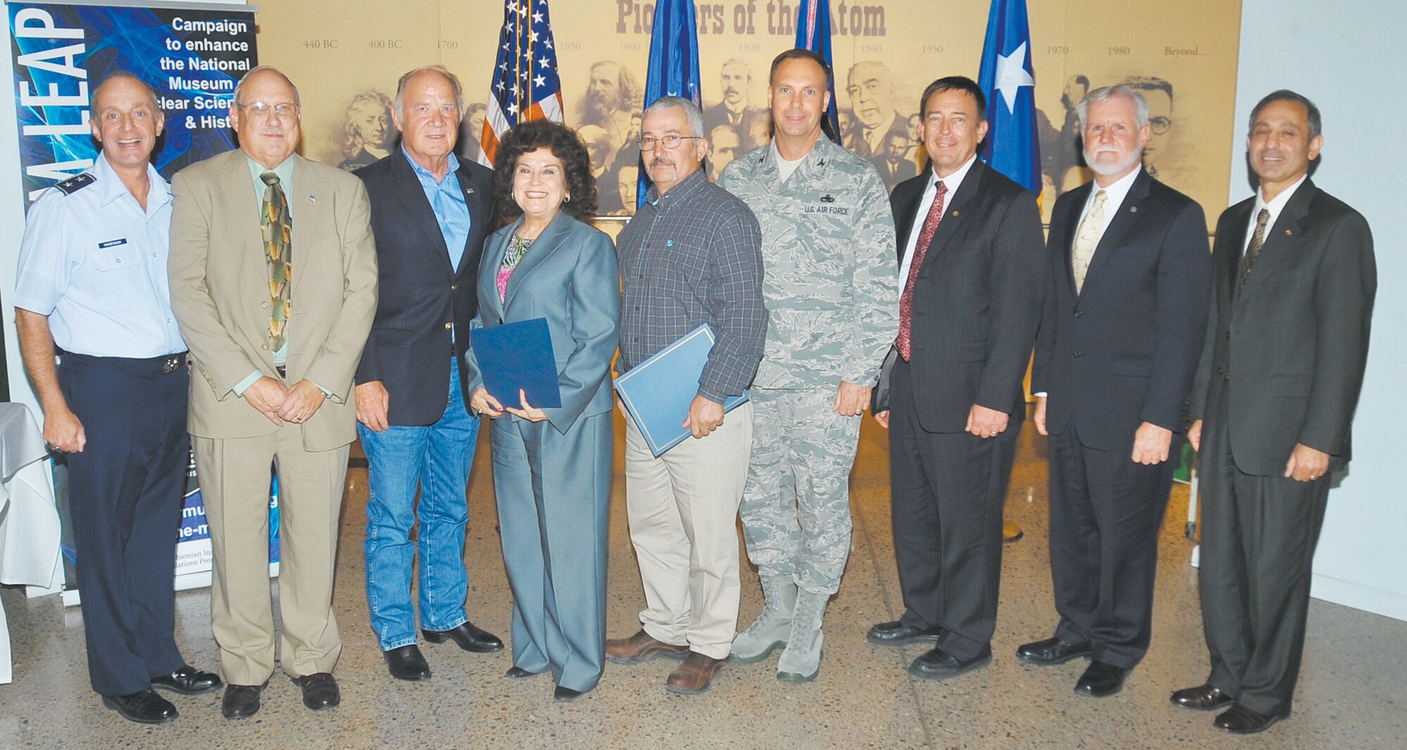 KIRTLAND AFB, N.M. -- The Air Force Nuclear Weapons Center inducted the newest members of the “Order of the Nucleus” Sept. 5 at the National Museum of Nuclear Science and History in Albuquerque. Pictured are, from left, Maj. Gen. Garrett Harencak, AFNWC commander, Dr. Byron Ristvet, Sherman McCorkle, Vita Kelley, Retired Chief Master Sgt. Mike Jones, Col. Marcus Novak, Retired Maj. Gen. Robert Smolen, Steve Henry and Mohsen Parhizkar. (Photo by Todd Berenger)