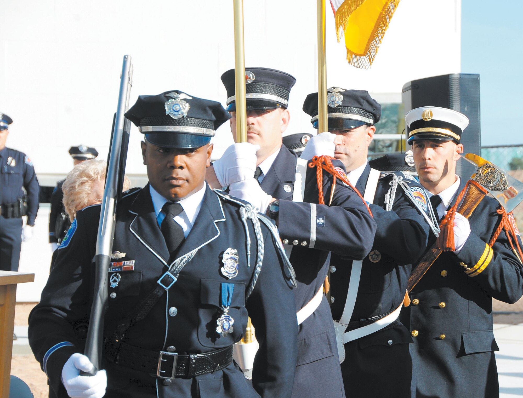KIRTLAND AFB, N.M. -- The Albuquerque Police Department and Fire Department Honor Guard present the colors before a 9/11 ceremony at the Fire Station 2 construction site Tuesday. (Photo by Dennis Carlson)