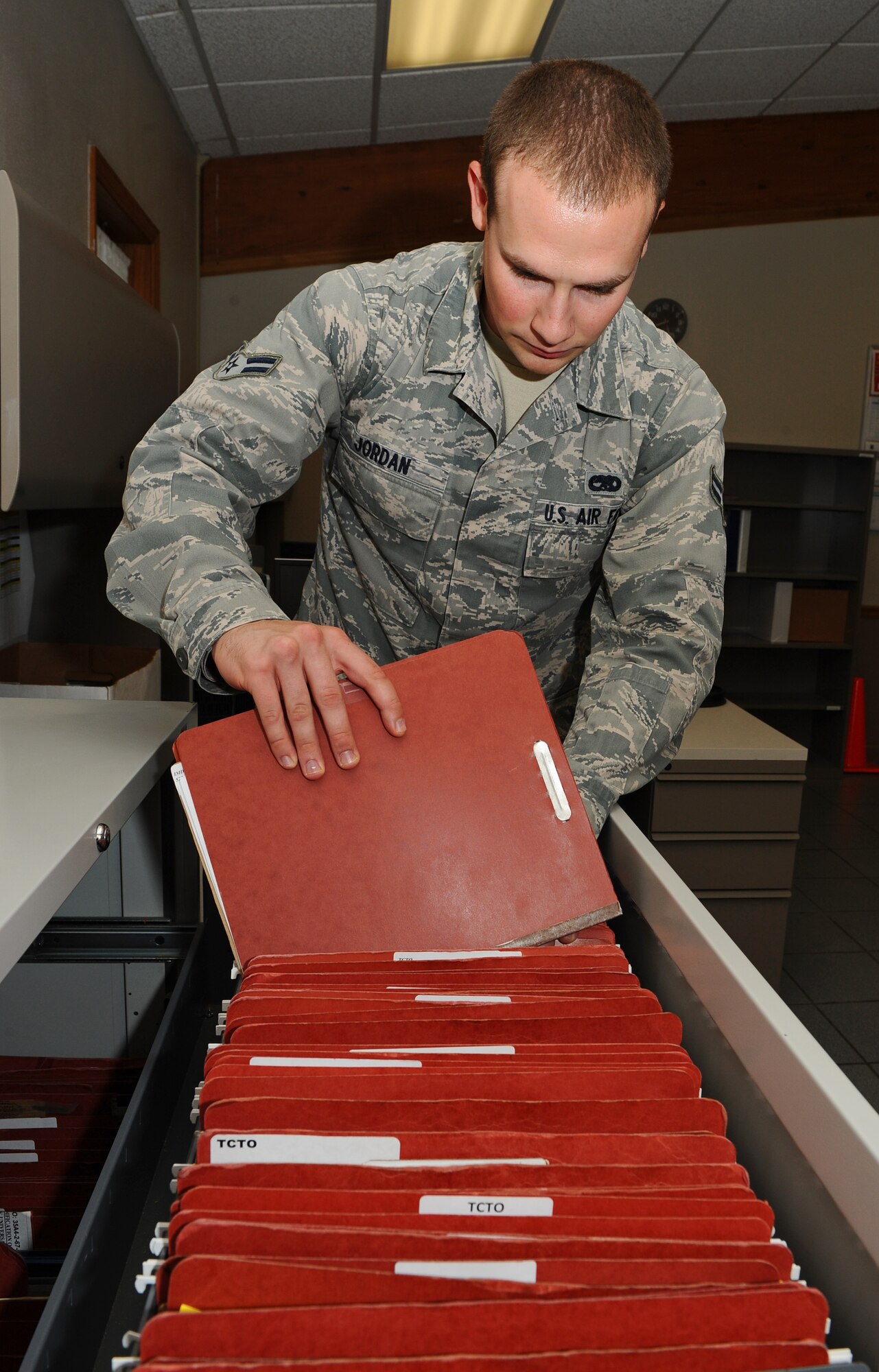Airman 1st Class Ben Jordan, 2nd Maintenance Operations Squadron assistant time compliance technical order monitor, files a TCTO on Barksdale Air Force Base, La., Sept. 6. When there is a time-sensitive need to upgrade a part of an aircraft or piece of equipment, a TCTO is submitted. (U.S. Air Force photo/Airman 1st Class Benjamin Gonsier)(RELEASED)
