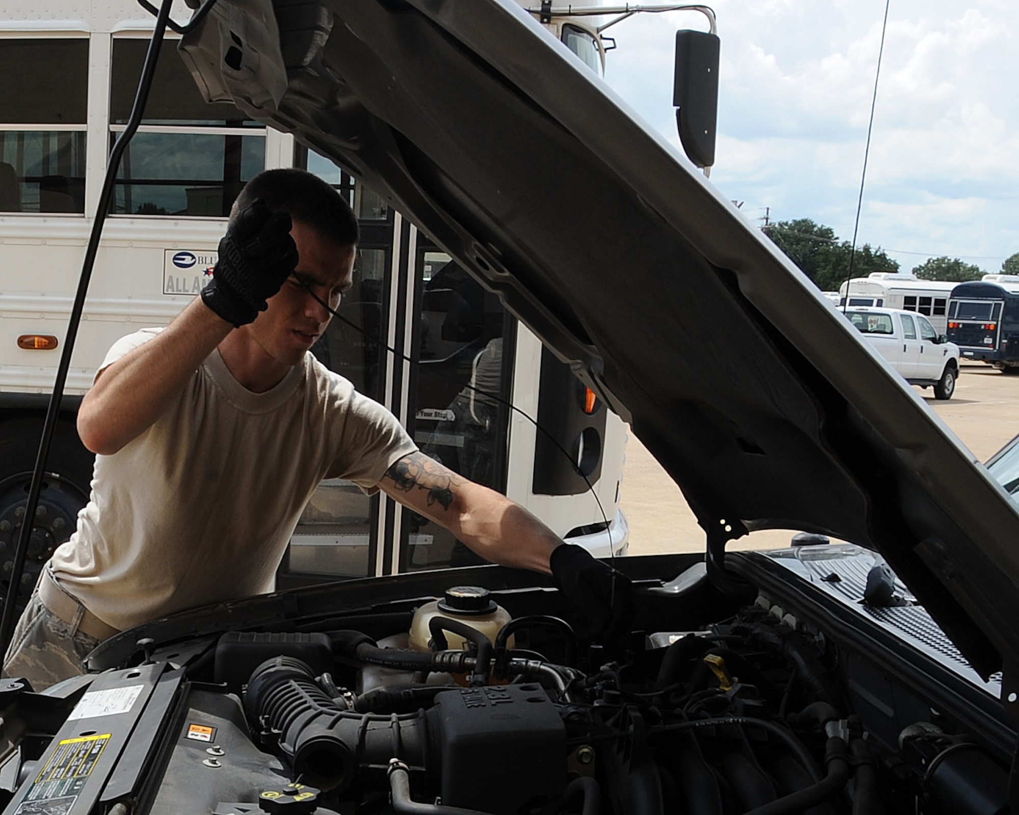 Senior Airman Bradley Opfar, 2nd Logistics Readiness Squadron vehicle operator, checks the oil level in a government operated vehicle during a routine inspection on Barksdale Air Force Base, La., Sept. 13. Vehicle Operations is in charge of maintaining and inspecting all GOV?s on the base. (U.S. Air Force photo/Senior Airman Sean Martin) (RELEASED)
