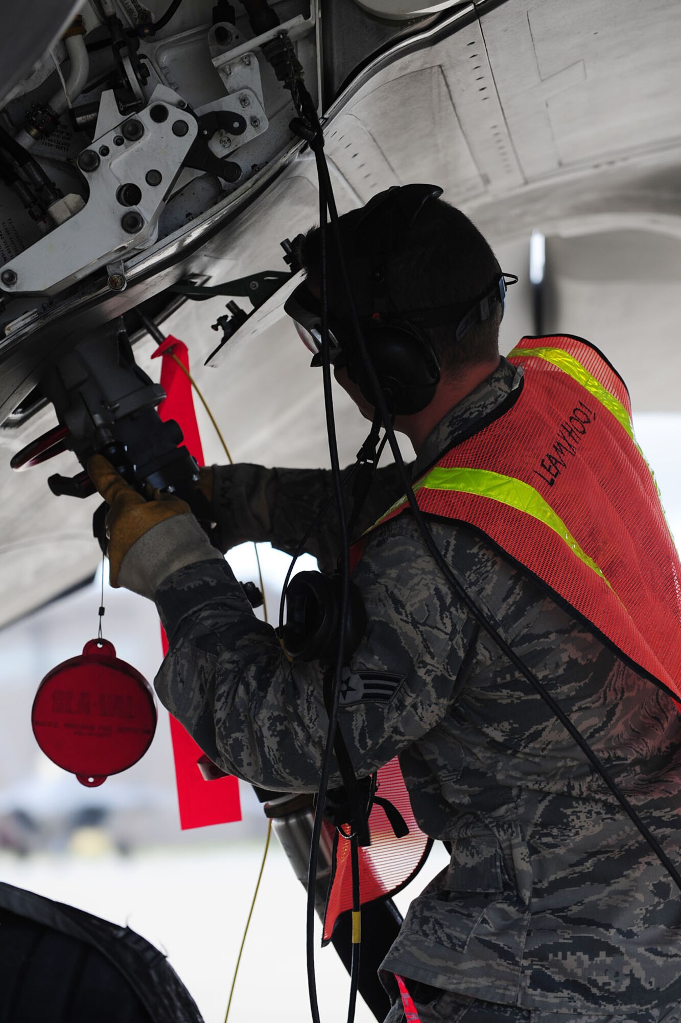 U.S. Air Force Senior Airman Timothy Deardorff, 1st Maintenance Squadron egress journeyman, detaches a hose from an F-22 Raptor during a Hydrant Mobile Refueler procedure at Langley Air Force Base, Va., Sept. 13, 2012. Instead of one truck per aircraft, the HYMORE system allows many aircraft to be fueled at the same time, with a virtually endless supply of underground fuel. (U.S. Air Force photo by Staff Sgt. Ashley Hawkins/Released)