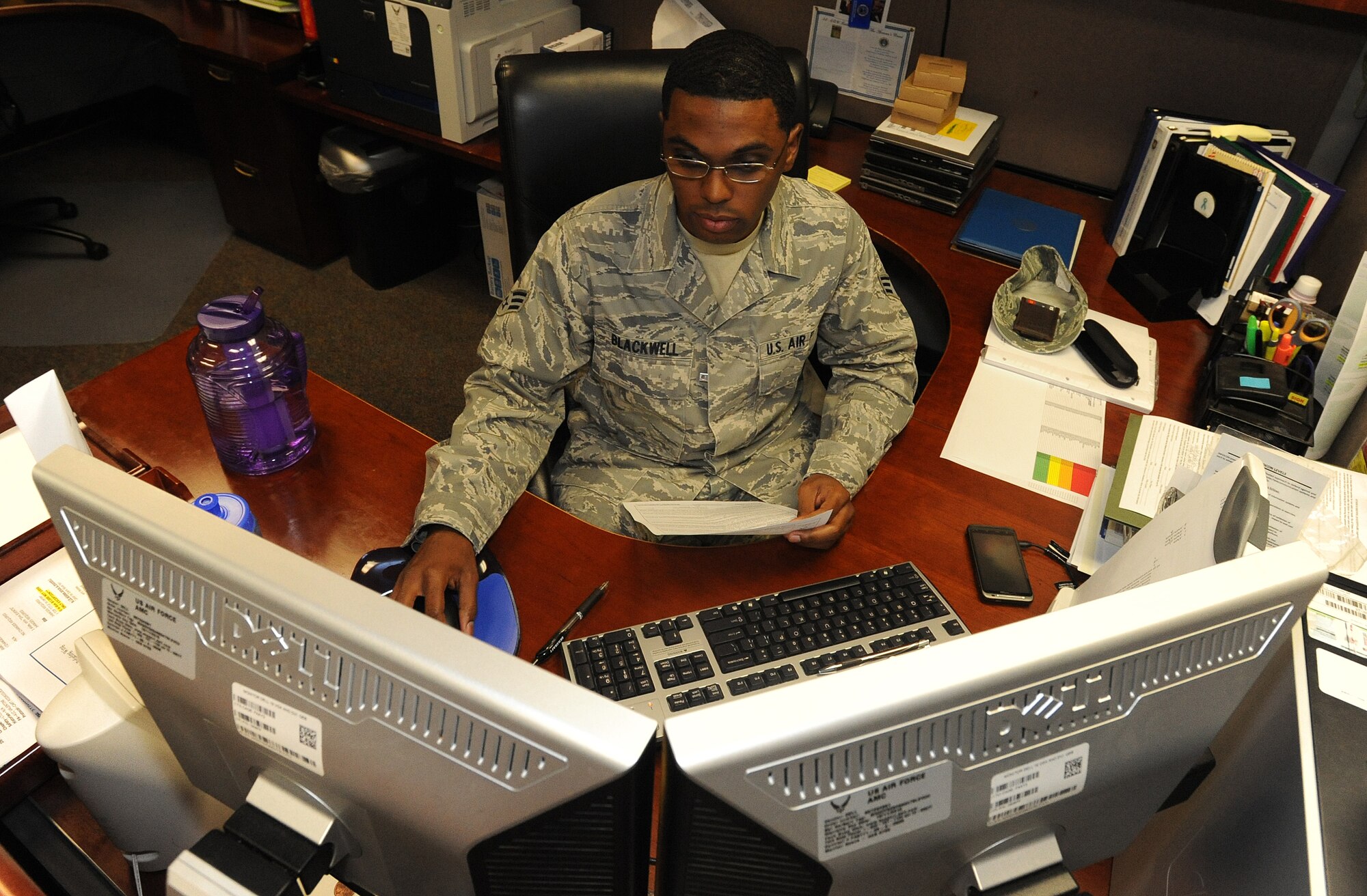Senior Airman Christopher Blackwell, 22nd Air Refueling Wing knowledge operations manager, reviews an enlisted performance report Sept. 13, 2012, McConnell Air Force Base, Kan. As wing knowledge operations manager, Blackwell provides executive level administrative support for the wing commander, vice commander, command chief and two executive officers. Blackwell was recognized as the spotlight performer for the week Sept. 10 to 14. (U.S. Air Force photo/Airman 1st Class Katrina M. Brisbin)