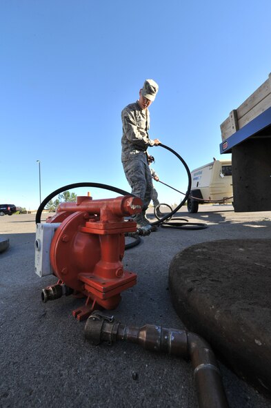 MINOT AIR FORCE BASE, N.D. -- Airman 1st Class Wilson Arocho, 5th Civil Engineer Squadron water and fuel systems maintainer, prepares his equipment to perform work on a fuel tank here, Sept. 12. Keeping the water level down is a recurring maintenance job that keeps the fuel system running correctly. (U.S. Air Force photo/Senior Airman Brittany Y. Auld)