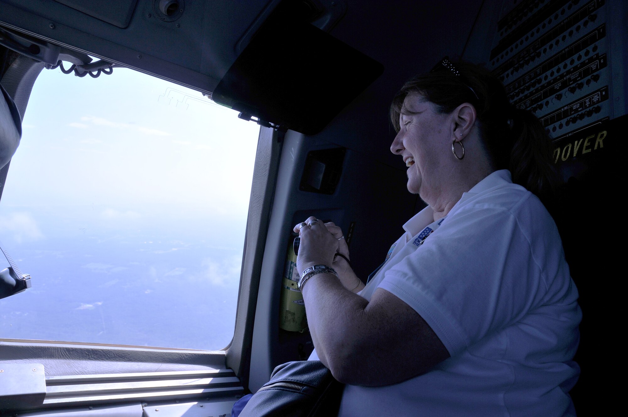 Johna-Lee Ingraham of Delaware's Employer Support of the Guard and Reserve program takes a picture from a flight deck window of a C-17 Globemaster III Sept. 8, 2012, on a flight that was part of the 512th Airlift Wing's annual Employer Appreciation Day. Ingraham and three other ESGR represenatives attended the event, as did 23 employers or supervisors of Dover Air Force Base, Del, reservists. ESGR is a Department of Defense agency with a mission to promote a culture in which employers support and value the military service of their employees by advocating relevant intitiatives, recognizing outstanding employer support, increasing awareness of the law and resolving conflicts through mediation. (U.S. Air Force photo by Senior Airman Erika C. Brooke)