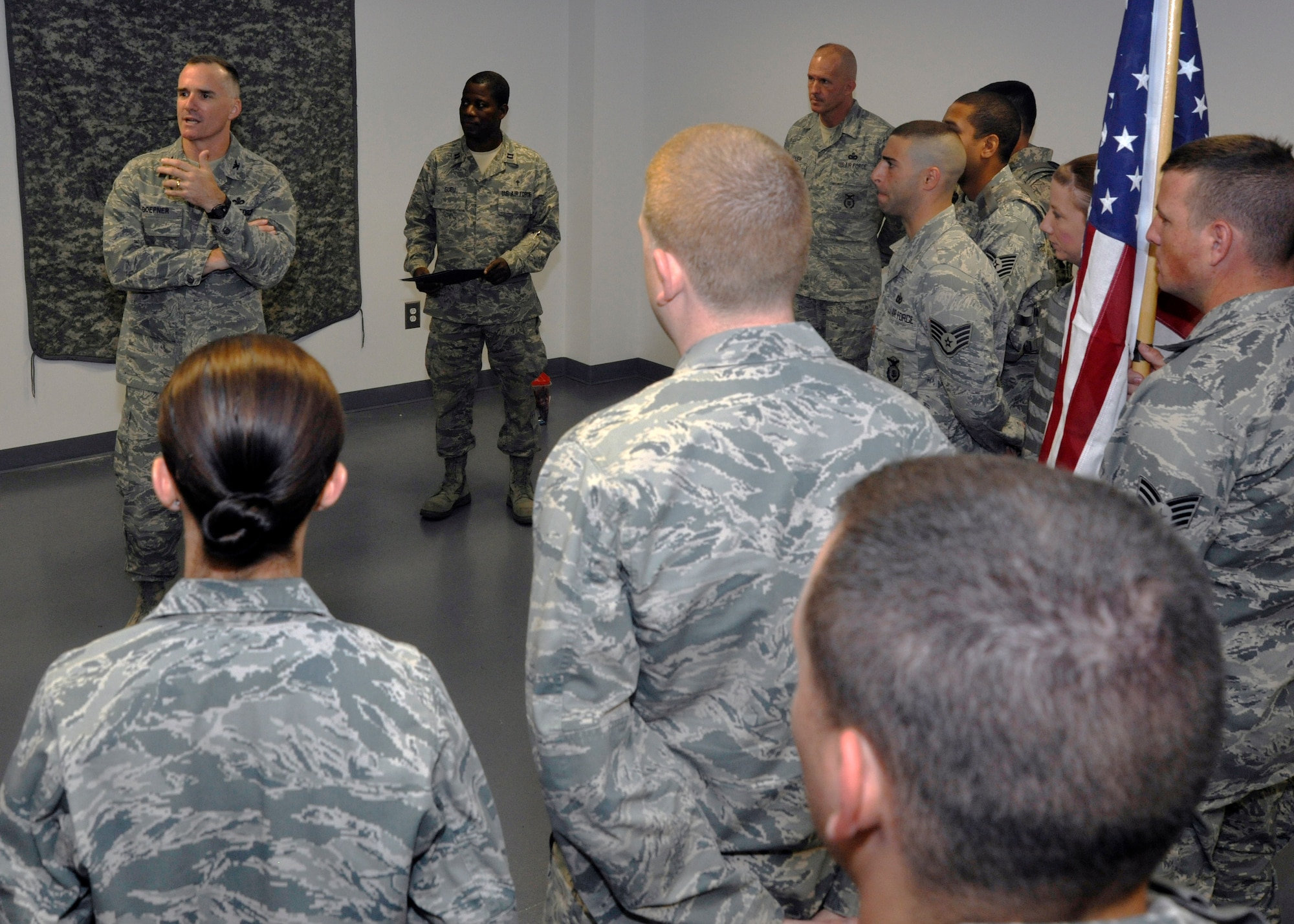 Col. Erik Goepner, 11th Security Forces Group commander, far left, gives 11th SFG Airmen remarks before leading them on a 9/11 Memorial Ruck March Sept. 11, 2012. The march lasted more than three hours and was held in remembrance of the Americans who lost their lives in the 9/11 terrorist attacks eleven years prior. (U.S. Air Force photo/Senior Airman Lindsey A. Porter)