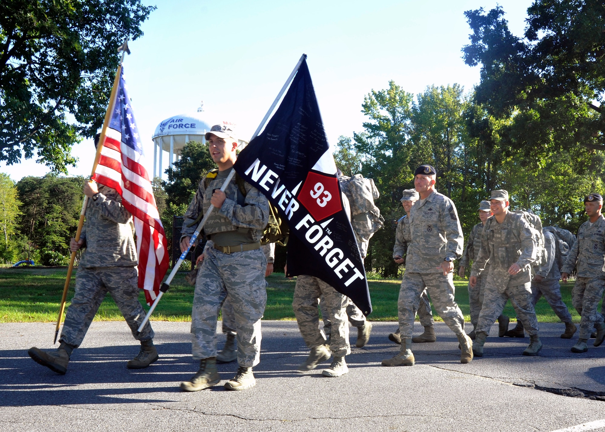 Members of the 11th Security Forces Group take the first steps of their nine-mile and 11,000-meter 9/11 Memorial Ruck March Sept. 11, 2012. Before beginning the march, Col. Erik Goepner, 11th Security Forces Group commander, and Chief Master Sgt. Todd Fuller, 11th SFG command chief, revealed a 9/11 Memorial Plaque to the Airmen which commemorated their participation in the 9/11 Memorial Ruck March last year that lasted more than 145 miles from Moorefield, W.Va., to Wells Tannery, Pa. (U.S. Air Force photo/Senior Airman Lindsey A. Porter)