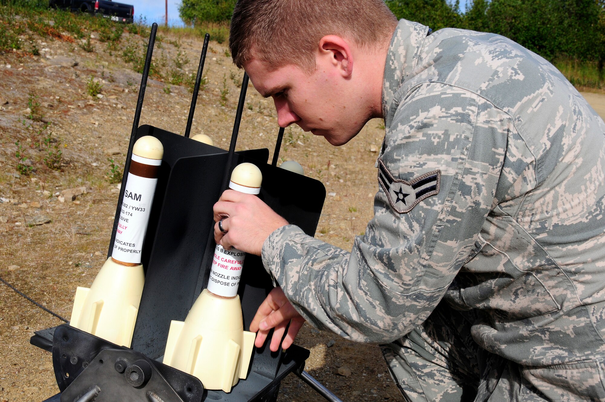 U.S. Air Force Airman 1st Class Brandon Larsen, 353rd Combat Training Squadron range division quality assurance evaluator, reloads a GTR-18 Smokey Sam during an exercise Aug. 17, 2012, Eielson Air Force Base, Alaska. The range division uses multiple simulated threats to engage targets during exercises such as RED FLAG-Alaska. (U.S. Air Force photo/Airman 1st Class Zachary Perras)