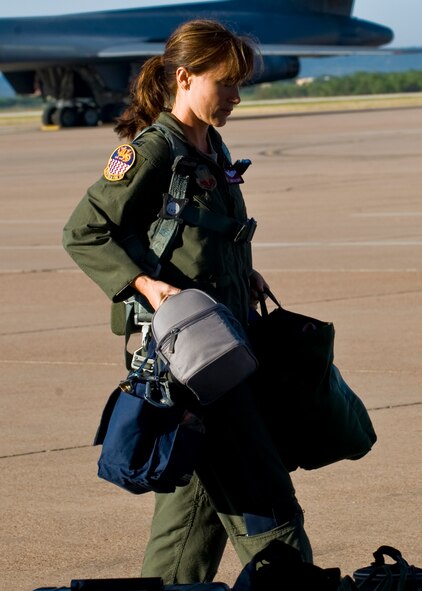 U.S. Air Force Capt. Alicia Datzman, 337th Test and Evaluation Squadron, readies her gear prior to boarding a B-1 Bomber Sept. 7, 2012, at Dyess Air Force Base, Texas. Datzman is one of eight B-1 pilots competing in the 3rd annual Global Strike Challenge. (U.S. Air Force photo by Airman 1st Class Charles V. Rivezzo/Released) 
