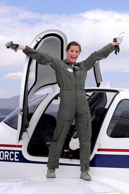 Cadet 1st Class Staci Rouse emerges enthusiastically from a T-53A trainer that she flew solo, marking a historic first for the Air Force Academy's powered flight program. Rouse, a native of Woodridge, N.J., is assigned to Cadet Squadron 40. (U.S. Air Force photo/Mike Kaplan)