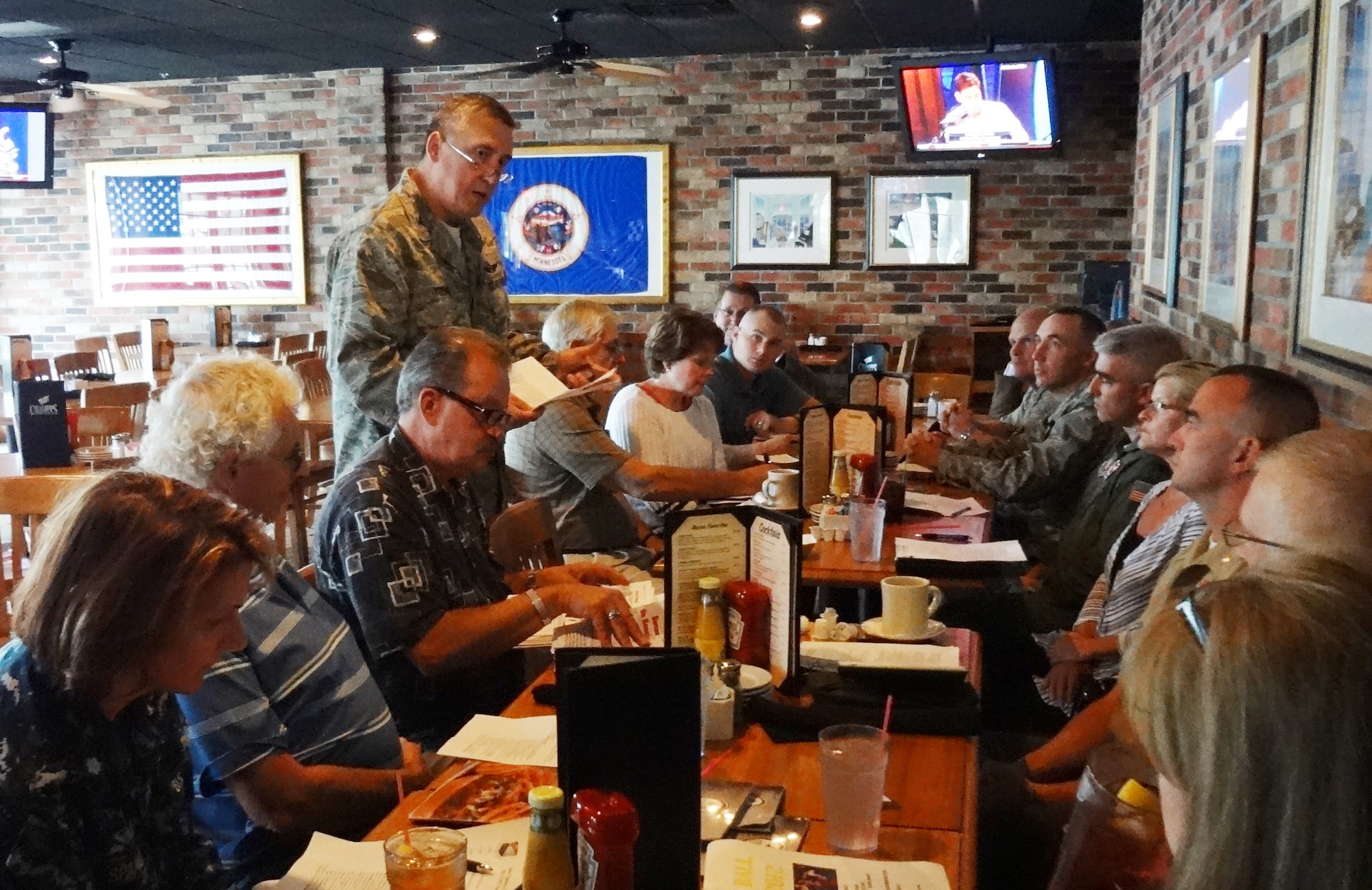 Col. Darrell G. Young, 934th Airlift Wing commander, talks with Base Community Council members Sept. 12. The council meets quarterly to share information between Minneapolis-St. Paul Air Reserve Station leaders and members of the surrounding community. (Air Force Photo/Paul Zadach)