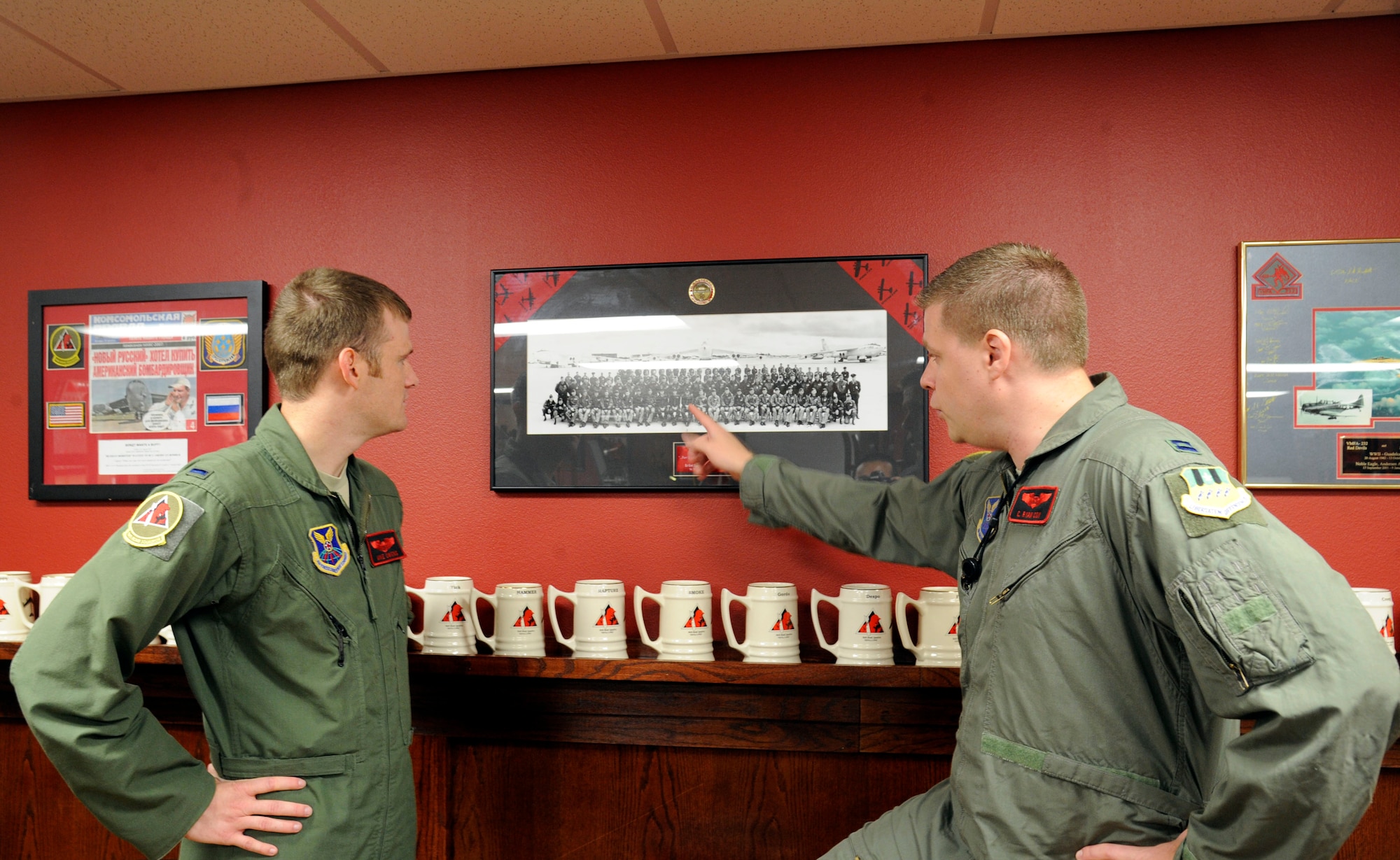 Capt. Christopher Cox, 96th Bomb Squadron scheduling flight commander (right), speaks to 1st Lieutenant Mike Owens, 96th BS B-52H Stratofortress co-pilot, about the 96th's history on Barksdale Air Force Base, La., Sept. 12. The 96th BS began as the 96th Aerosquadron in 1917 and was America's first bomber group. (U.S. Air Force photo/Airman 1st Class Andrew Moua)(RELEASED)