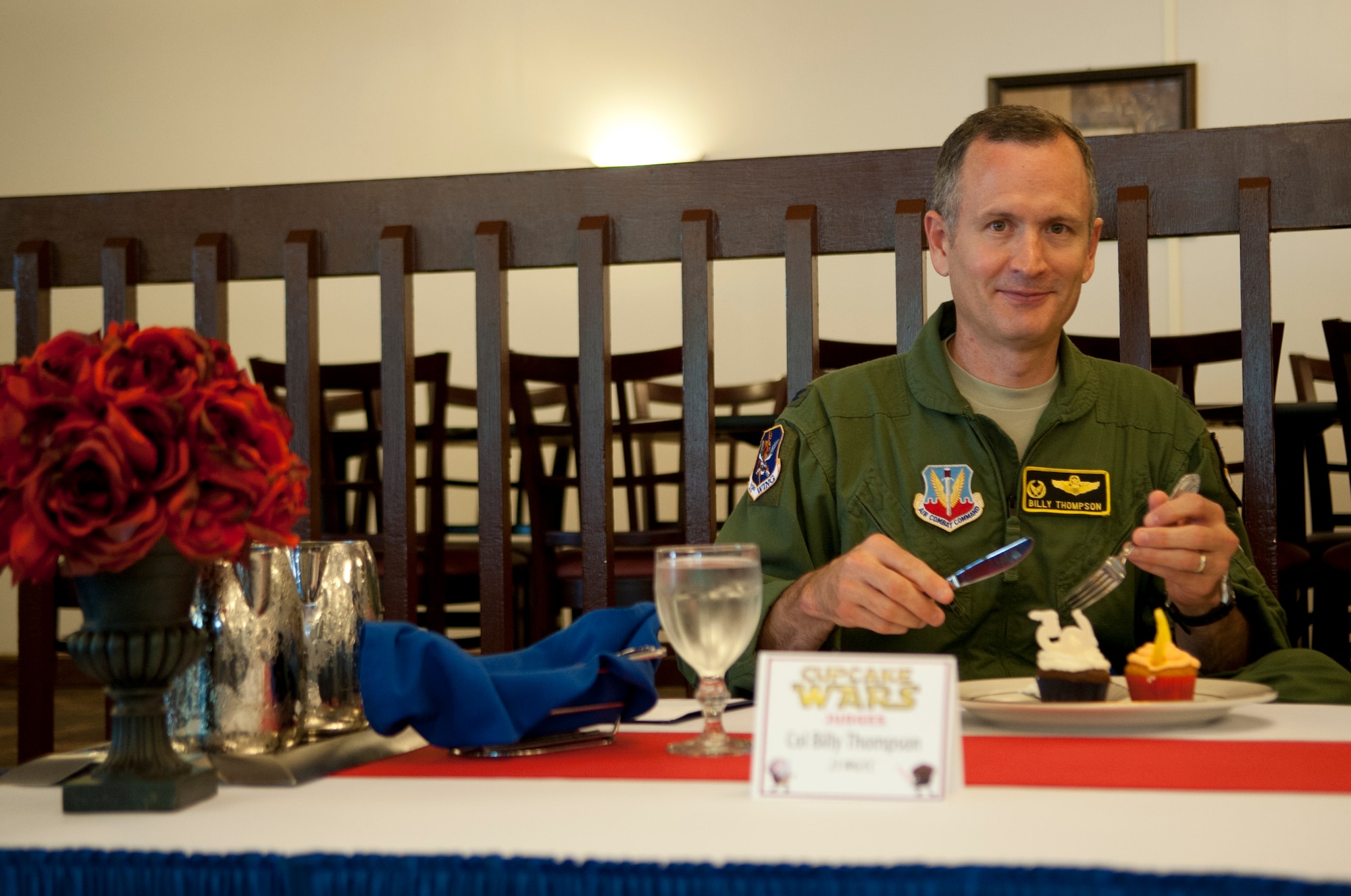 U.S. Air Force Col. Billy Thompson, 23d Wing commander, prepares to taste cupcakes from the second team, “Tasty Tiger Baking Company,” Aug. 28, 2012, at Moody Air Force Base, Ga. Thompson was one of four judges who critiqued the cupcakes. (U.S. Air Force photo by Airman 1st Class Paul Francis/Released)
