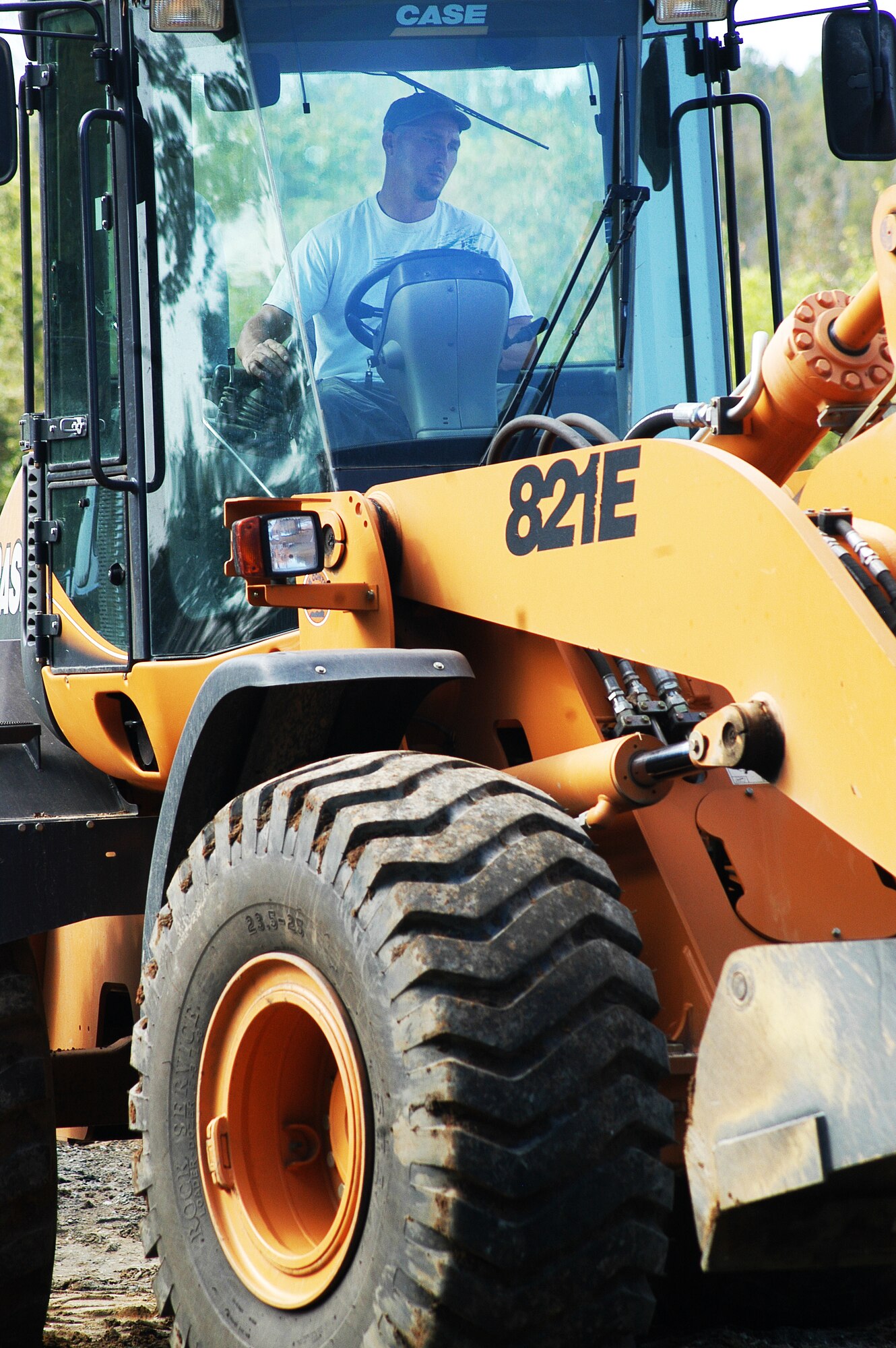 Matt Allen uses a loader to remove asphalt along Hannah Road Sept. 7.  Hannah Road is currently closed for a major construction project to replace a damaged drainage culvert and repair the bridge (U. S. Air Force photo/Sue Sapp)