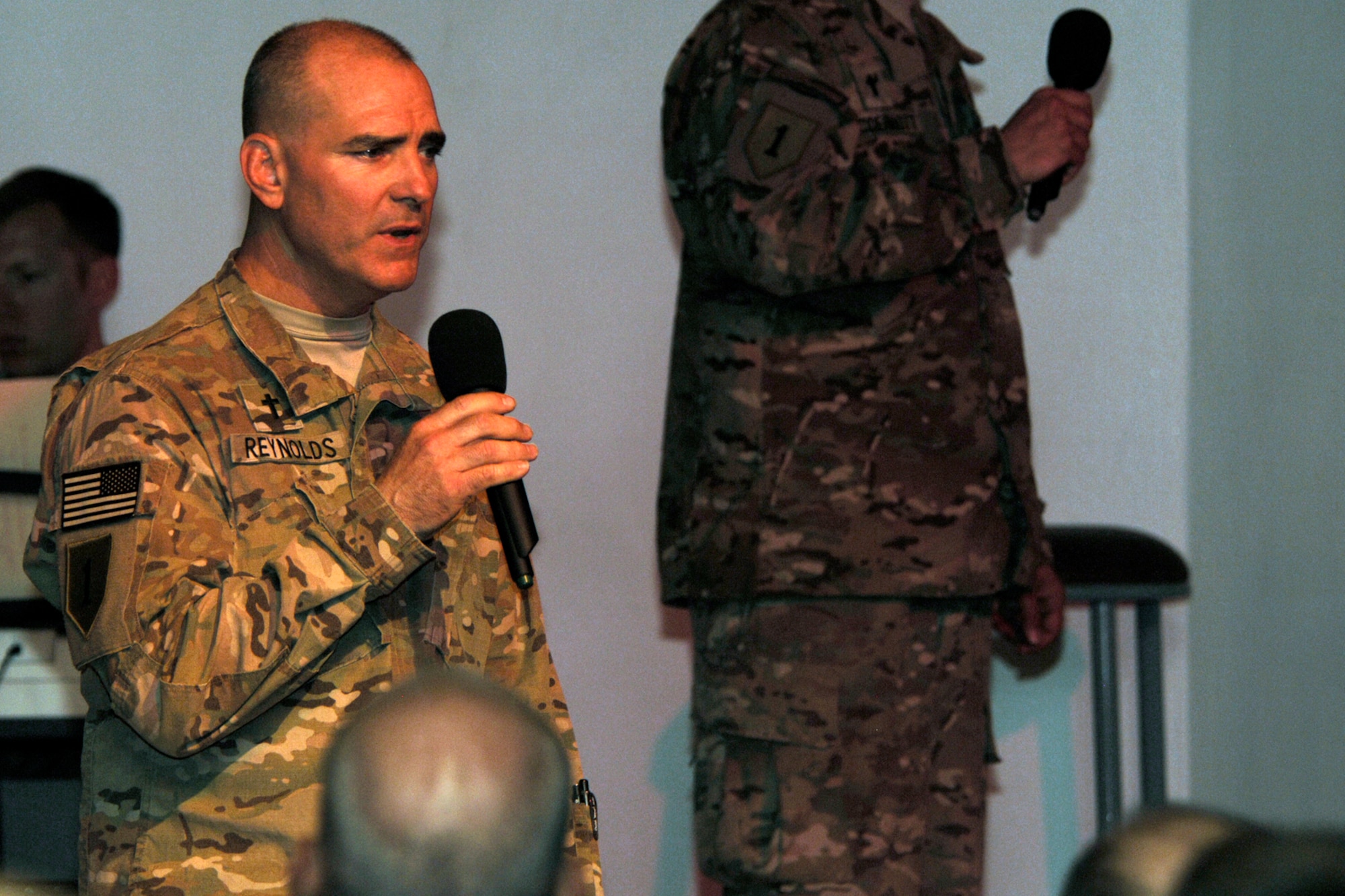 U.S. Army Chaplain (Maj) Timothy Reynolds sings during “9/11 in Memoriam,” a memorial observance held in the Enduring Faith Chapel at Bagram Airfield, Afghanistan, Sept. 11, 2012. The observance was written by Bill Monaghan, a singer/song writer who lost his brother in 2010 during a U.S. Navy training accident. (U.S. Air Force photo/SSgt Jeff Nevison)