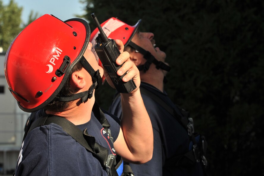 MINOT AIR FORCE BASE, N.D. -- Firefighters from the 5th Civil Engineer Squadron here and Barksdale Air Force Base, La.’s 2nd CES, including Airmen from the Arnold Engineering Development Center, participate in high angle rescue training exercise here, Aug. 20.  Rescue Technician Instructors Staff Sgt. Aaron Brackett and Tech Sgt. David Hagenbuch from the Louis F. Garland Department of Defense Fire Academy at Goodfellow Air Force Base, Texas, came to Minot AFB as part of the Mobile Training Team. The MTT goes from base to base offering training that is conducted year round at the Fire Academy. (U.S. Air Force photo/Senior Airman Brittany Y. Auld) 