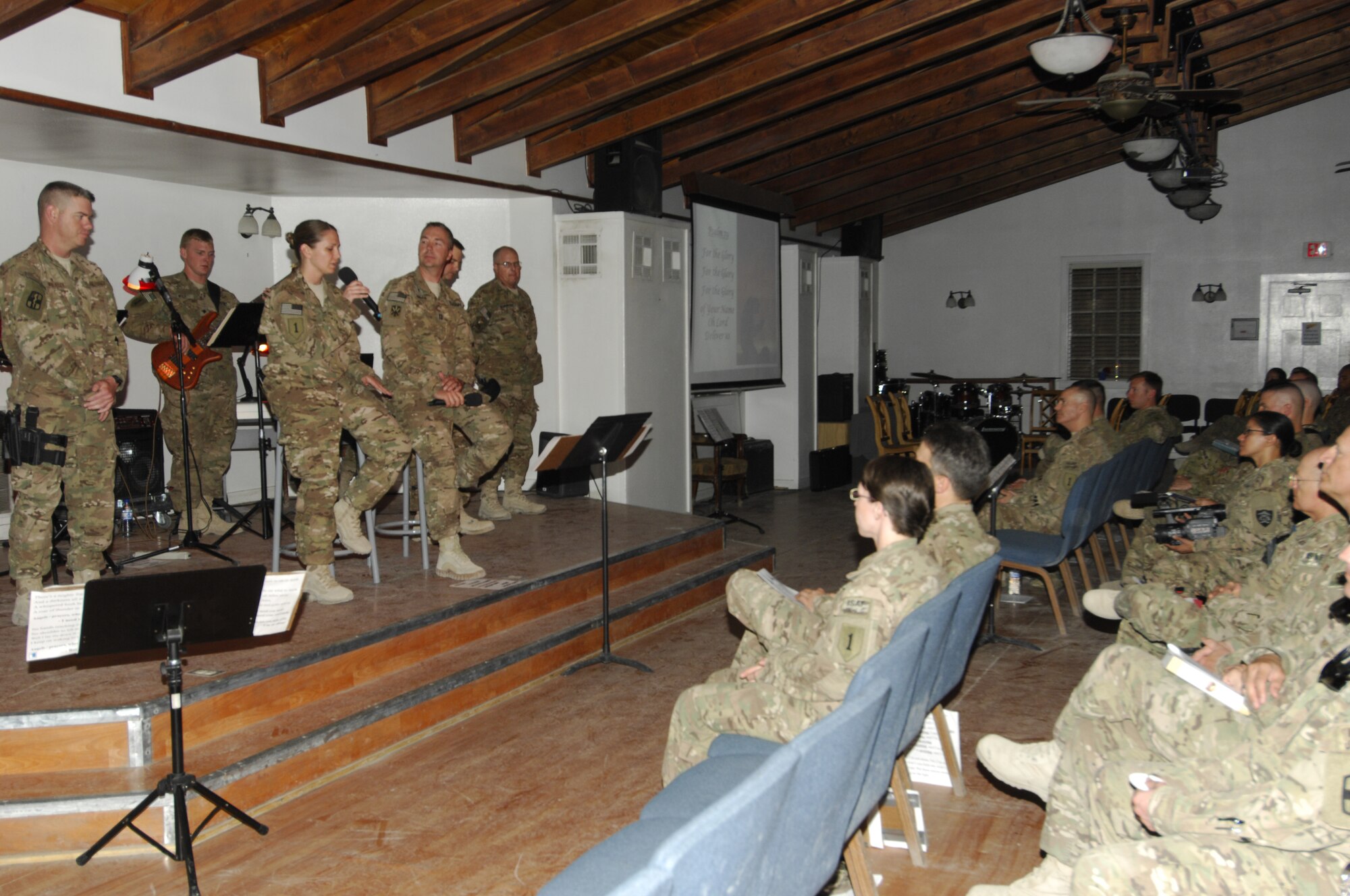 Singers and musicians perform various songs from“9/11 in Memoriam,” a memorial observance held in the Enduring Faith Chapel at Bagram Airfield, Afghanistan, Sept. 11, 2012. The observance was written by Bill Monaghan, a singer/song writer who lost his brother in 2010 during a U.S. Navy training accident. (U.S. Air Force photo/SSgt Jeff Nevison)