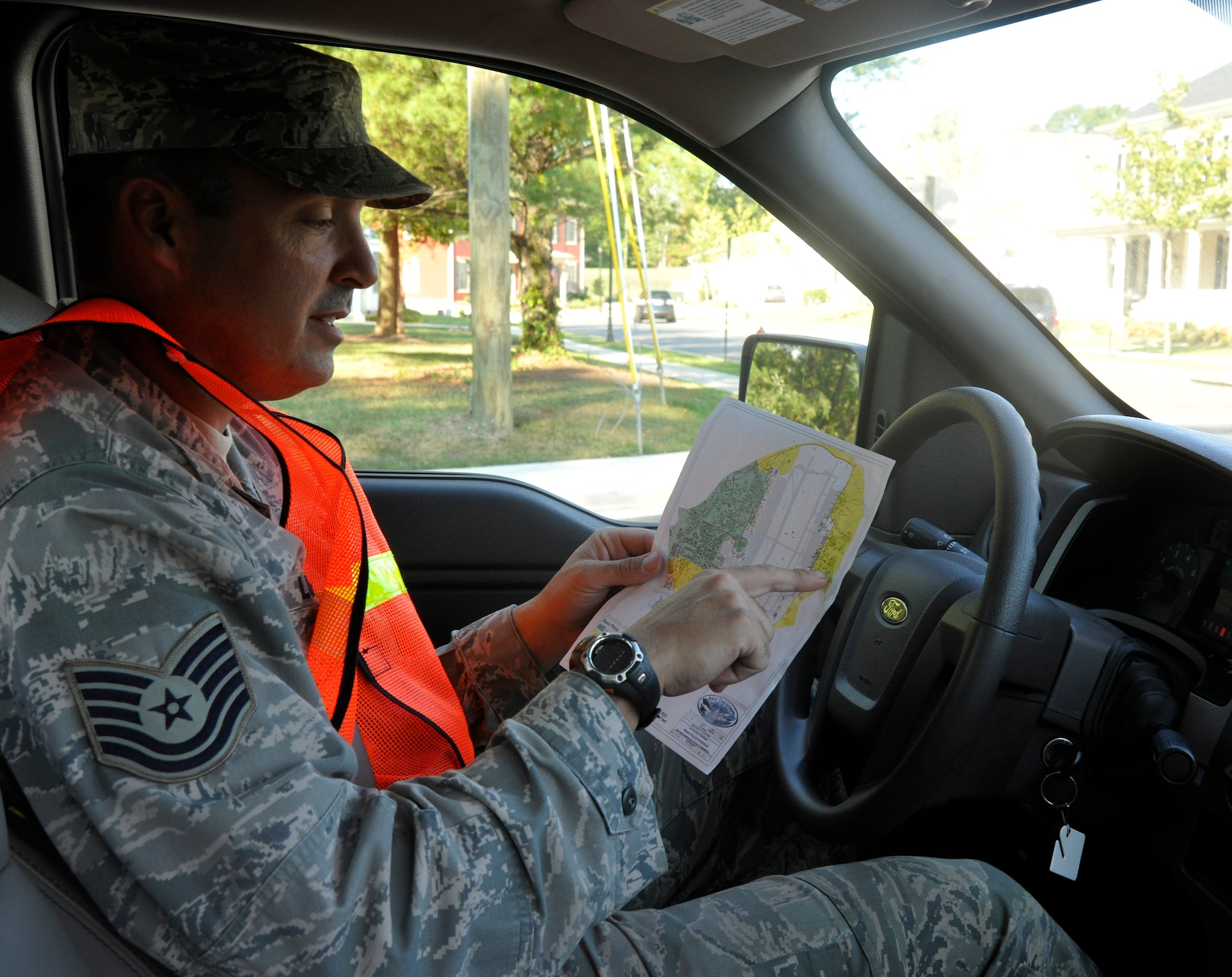 Tech. Sgt. Jody Lucas, Andrews Base Pride NCO in charge, discusses clean-up routes for a team of Base Pride detail Airmen Aug. 16, 2012.  With two clean-up routes divided between two detail teams, Base Pride Airmen select a team at the beginning of each day to ride with. (U.S. Air Force photo/Senior Airman Lindsey A. Porter)