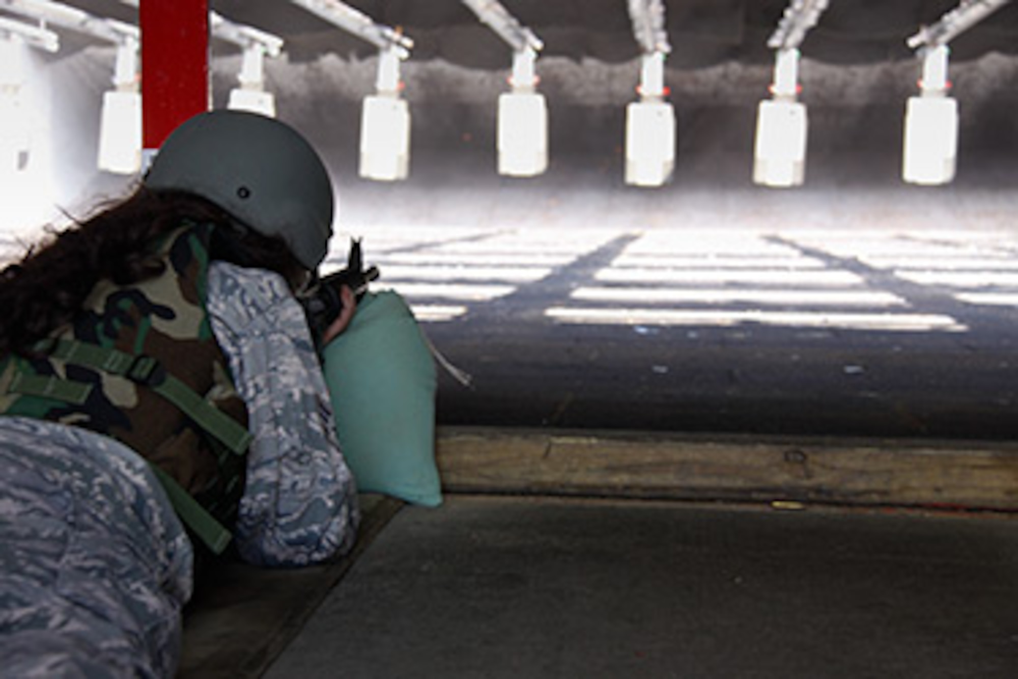 Senior Airman Tasha Gresco, 911th Airlift Wing public affairs specialist, aims down range at her target during M-16 qualification training at the Combat Arms Training and Maintenance range, Clinton, Pa., Sept. 9, 2012. The state-of-the-art CATM range, which is also used by 29 other agencies such as the U.S. Army, Police academy and Transportation Security Administration can also train with various types of weapons at the 143 acre property to receive their qualification.  (U.S. Air Force photo by Senior Airman Justyne Obeldobel/Released)