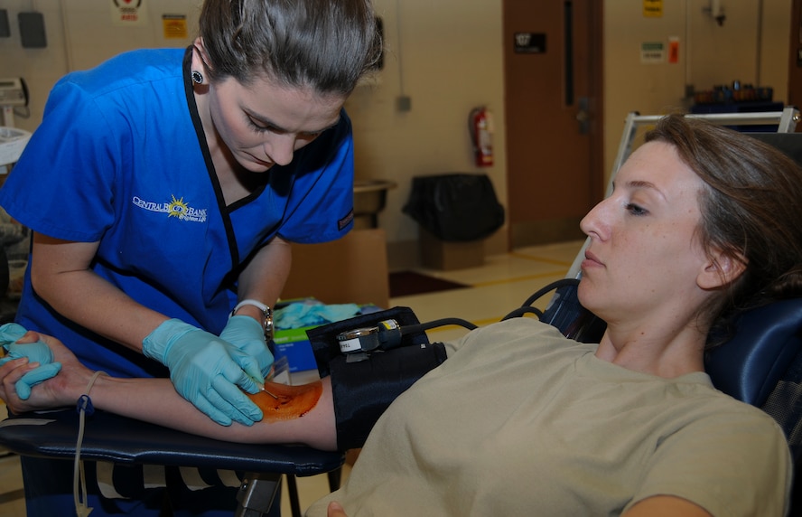 Senior Airman Aimee Plotz, 911th Aeromedical Staging Squadron medical technician, donates blood during the September Unit Training Assembly at the 911th Airlift Wing, Sept. 8, 2012. One pint of blood is split into three sections: platelets, plasma and red cells. The separated components of one pint of donated blood can help the lives of three people. (U.S. Air Force photo by Senior Airman Joshua J. Seybert/Released)