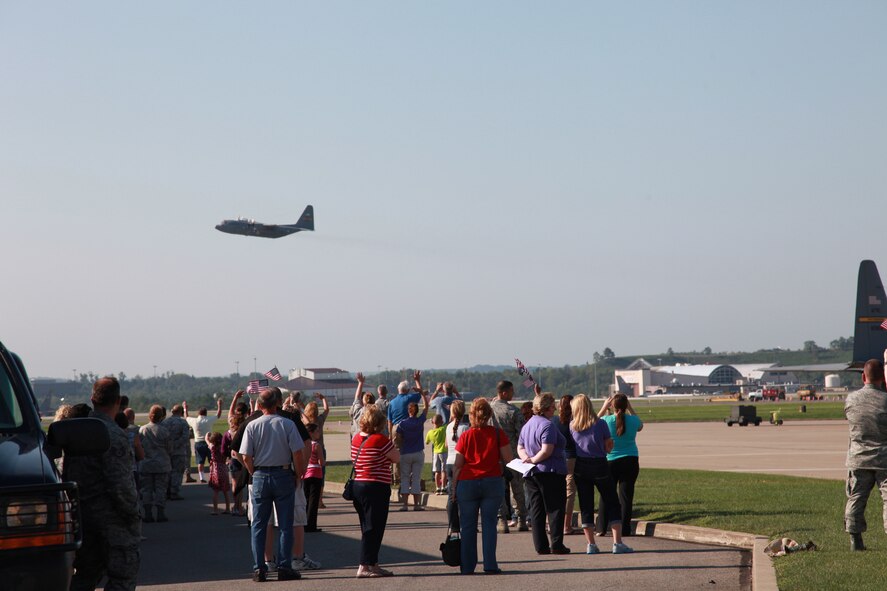 Families and friends wave good-bye to loved ones aboard a C-130 Hercules as they depart from the 911th Airlift Wing in Coraopolis, Pa., Sept. 6, 2012 for a four-month deployment overseas. The 911th AW will support the U. S. Central Command area of operations and are expected to deliver supplies and equipment, as well as U.S. and coalition forces throughout areas of Southwest Asia. (U.S. Air Force photo by Tech. Sgt. Ralph Van Houtem/Released)