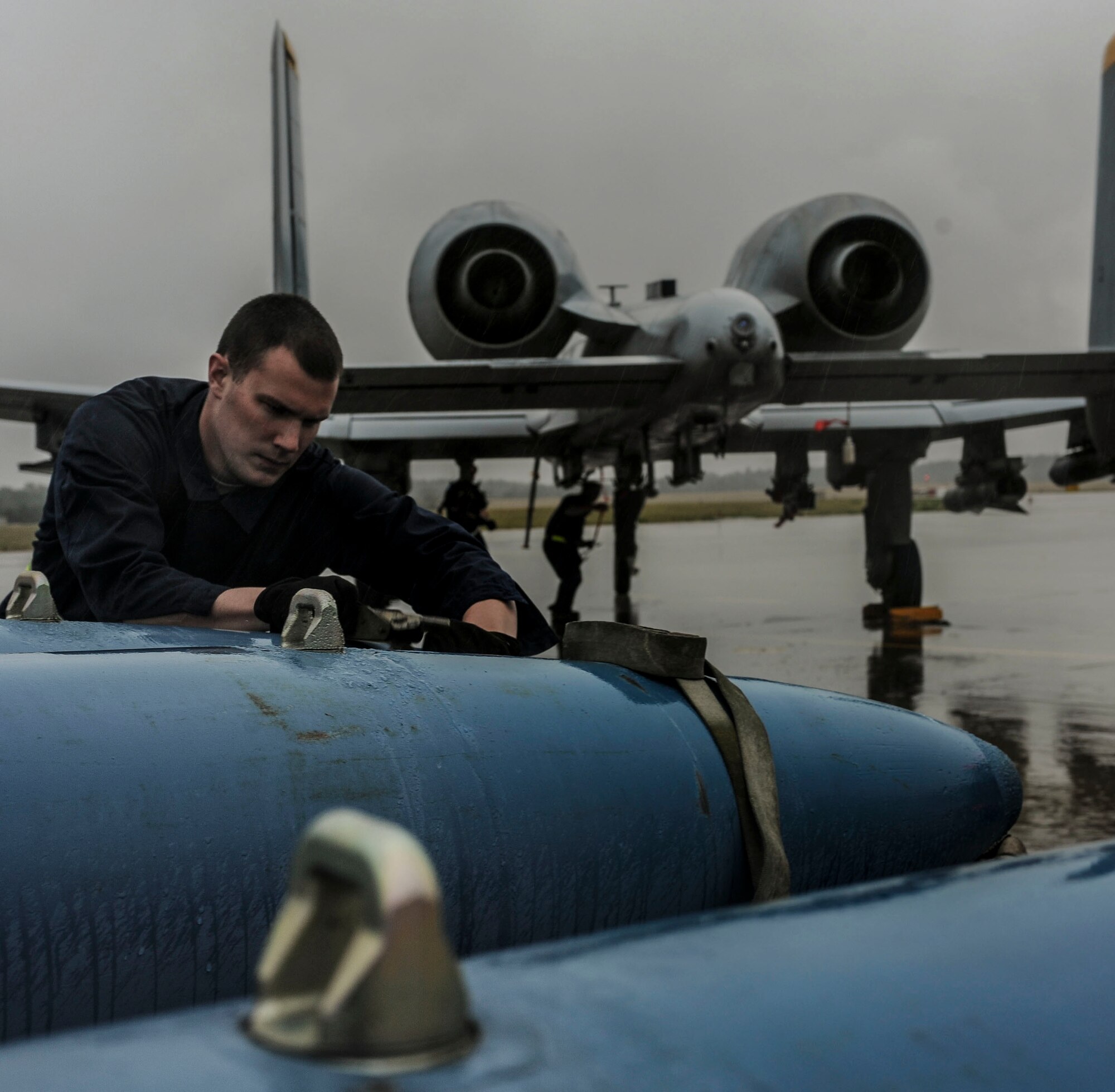 NAMEST AIR BASE, Czech Republic -- Airman 1st Class Joshua Teresas, 81st Aircraft Maintenance Unit weapons load crew member, prepares to load a training bomb to an A-10 Thunderbolt II Sept. 12, during Ramstein Rover 2012 here. The A-10 is providing close air support for a forward air control training mission. Participating in exercises like RARO 12 ensures effective employment of airpower in support of alliance or coalition forces while mitigating risks to civilians in contingency operations. (U.S. Air Force photo by Senior Airman Natasha Stannard/ Released)