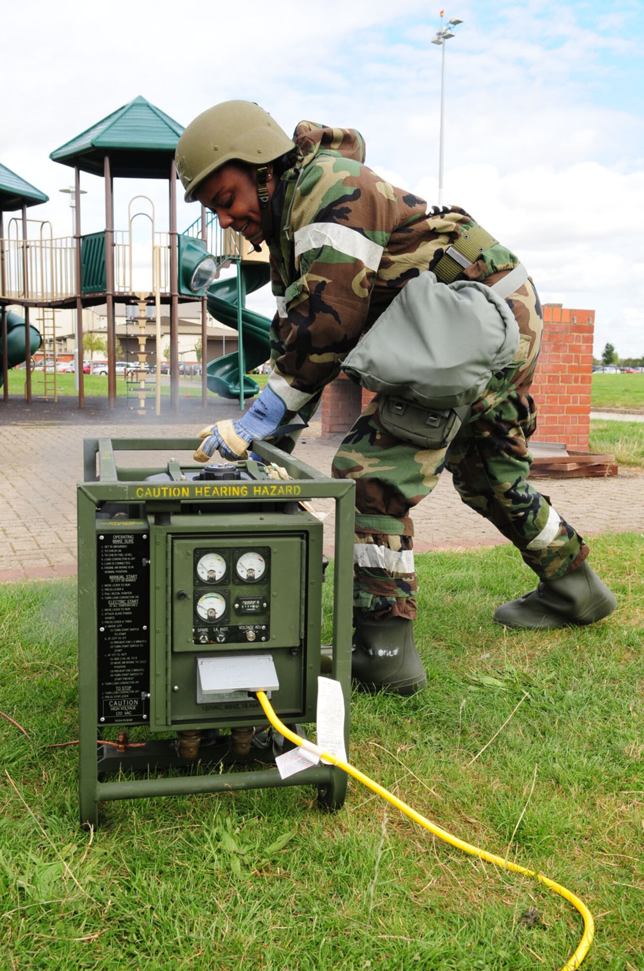 RAF MILDENHALL, England – Airman 1st Class Nicolette Williams, 100th Force Support Squadron Gateway Dining Facility services apprentice, starts a generator outside the temporary kitchen at a simulated deployed location on RAF Mildenhall Sept. 12, 2012, during an operational readiness exercise. During the ORE 100th FSS members set up the food facility in addition to performing post-attack reconnaissance sweeps around buildings. (U.S. Air Force photo/Karen Abeyasekere)