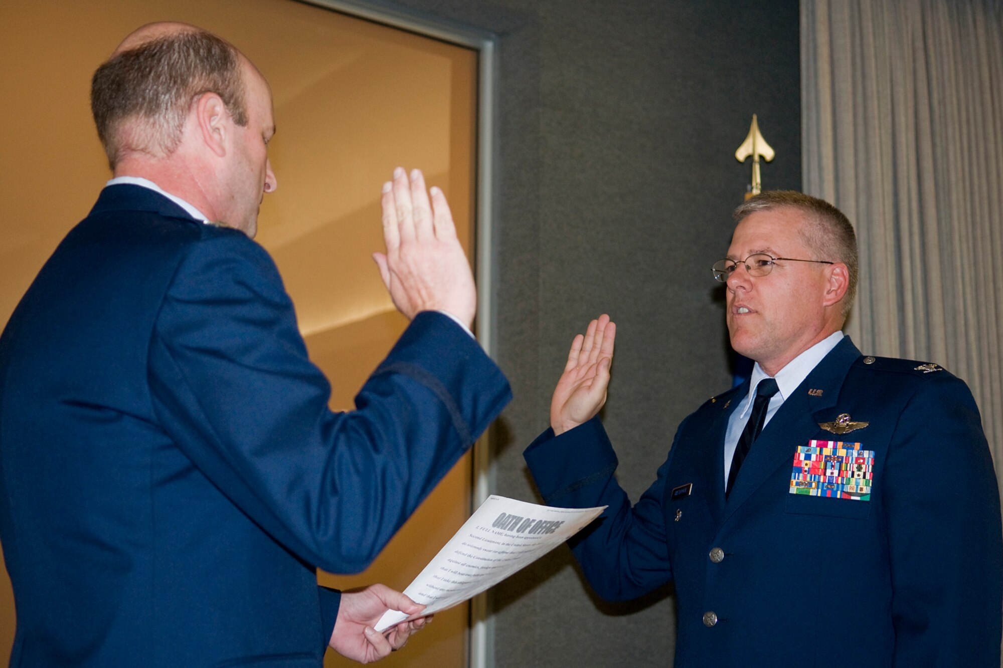 GRISSOM AIR RESERVE BASE, Ind. -- Col. Christopher Amend, left, administers an oath of office to a newly promoted Col. Paul Wietbrock during his pin-on ceremony here Aug. 25. Amend is the 434th Operations Group commander, and Wietbrock left his position as 434th OG deputy commander at Grissom a few months ago to take a post as the 931st Air Refueling Group deputy commander at McConnell Air Force Base, Kan. (U.S. Air Force photo/Tech. Sgt. Mark Orders-Woempner)
